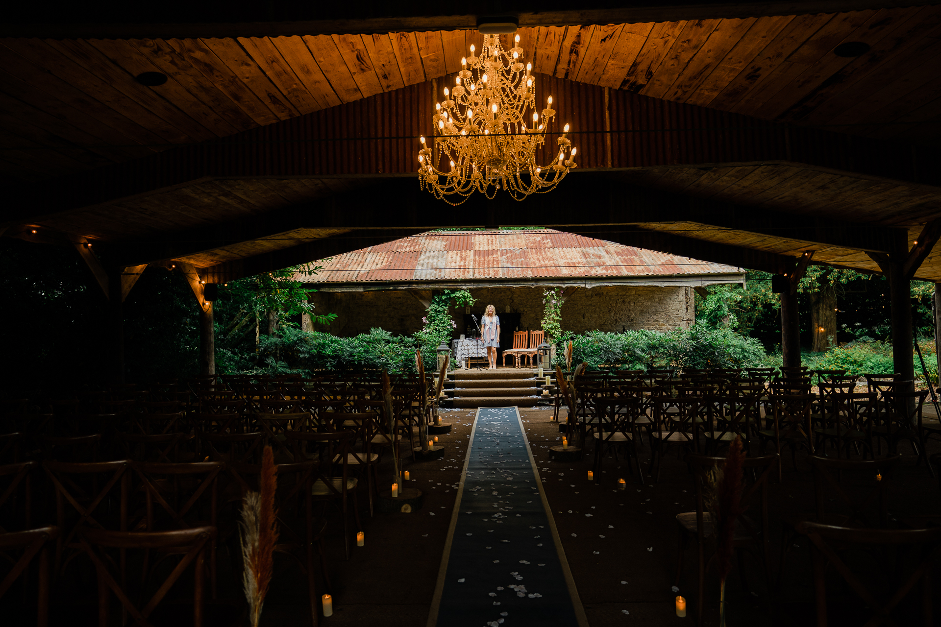 A large room with a chandelier and chairs