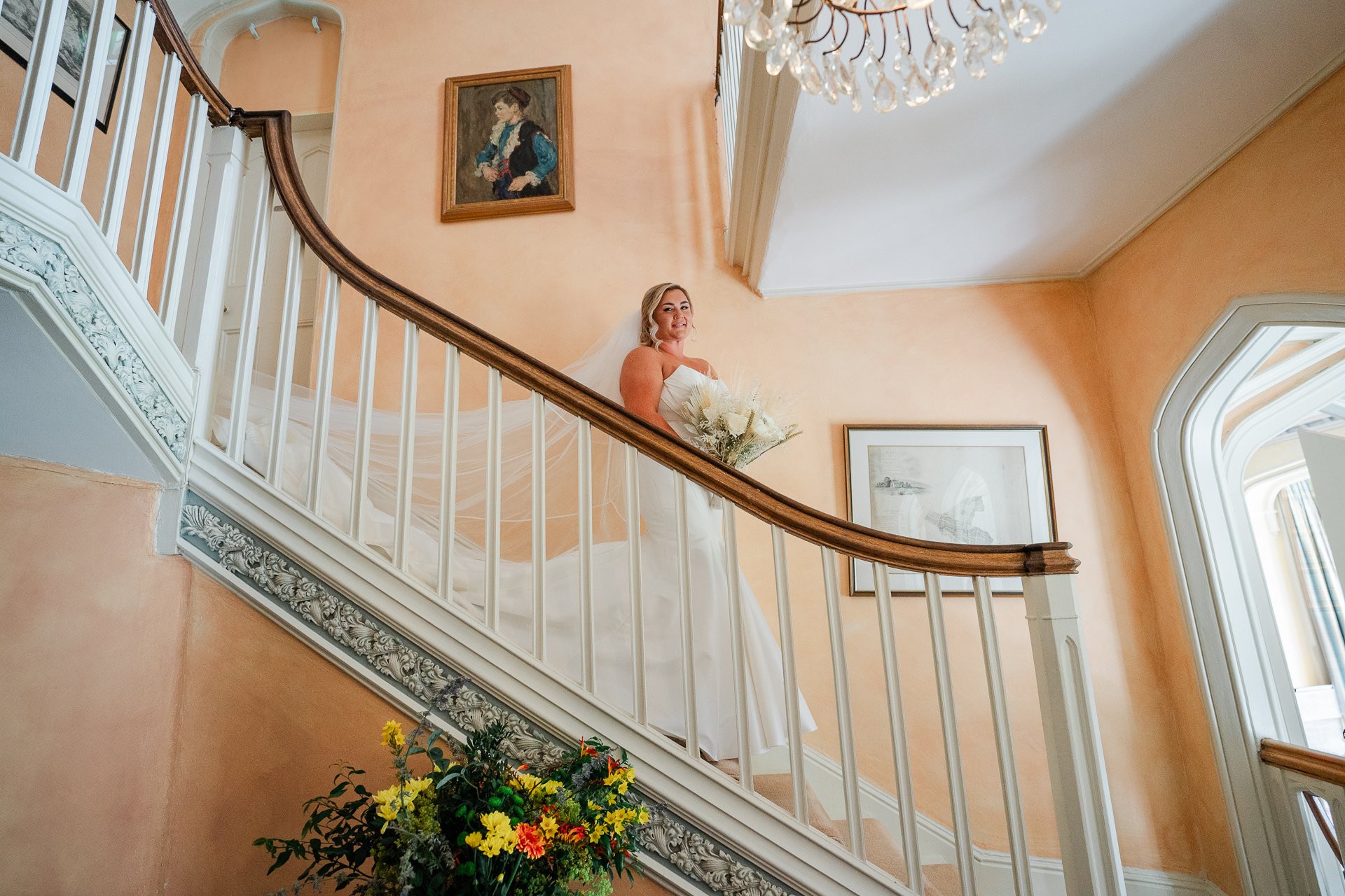 A person in a white dress on a staircase