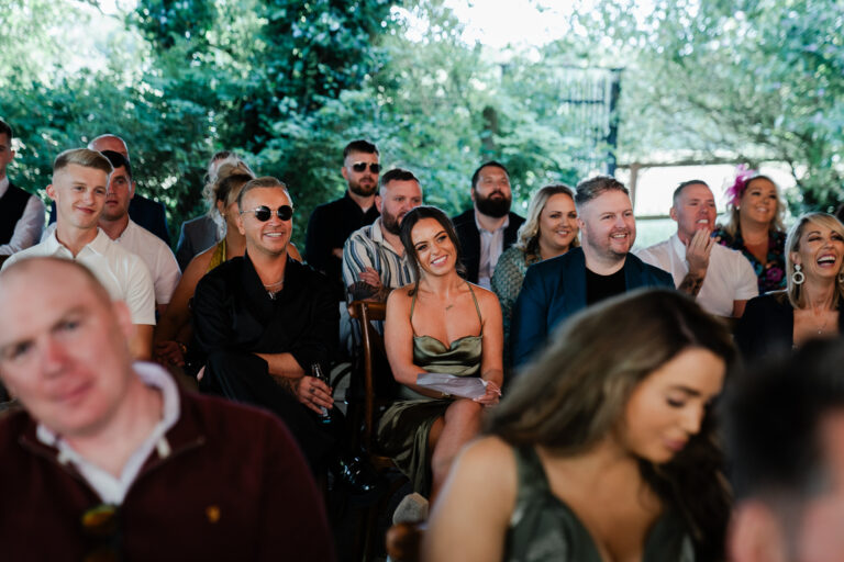 A group of people sitting outside