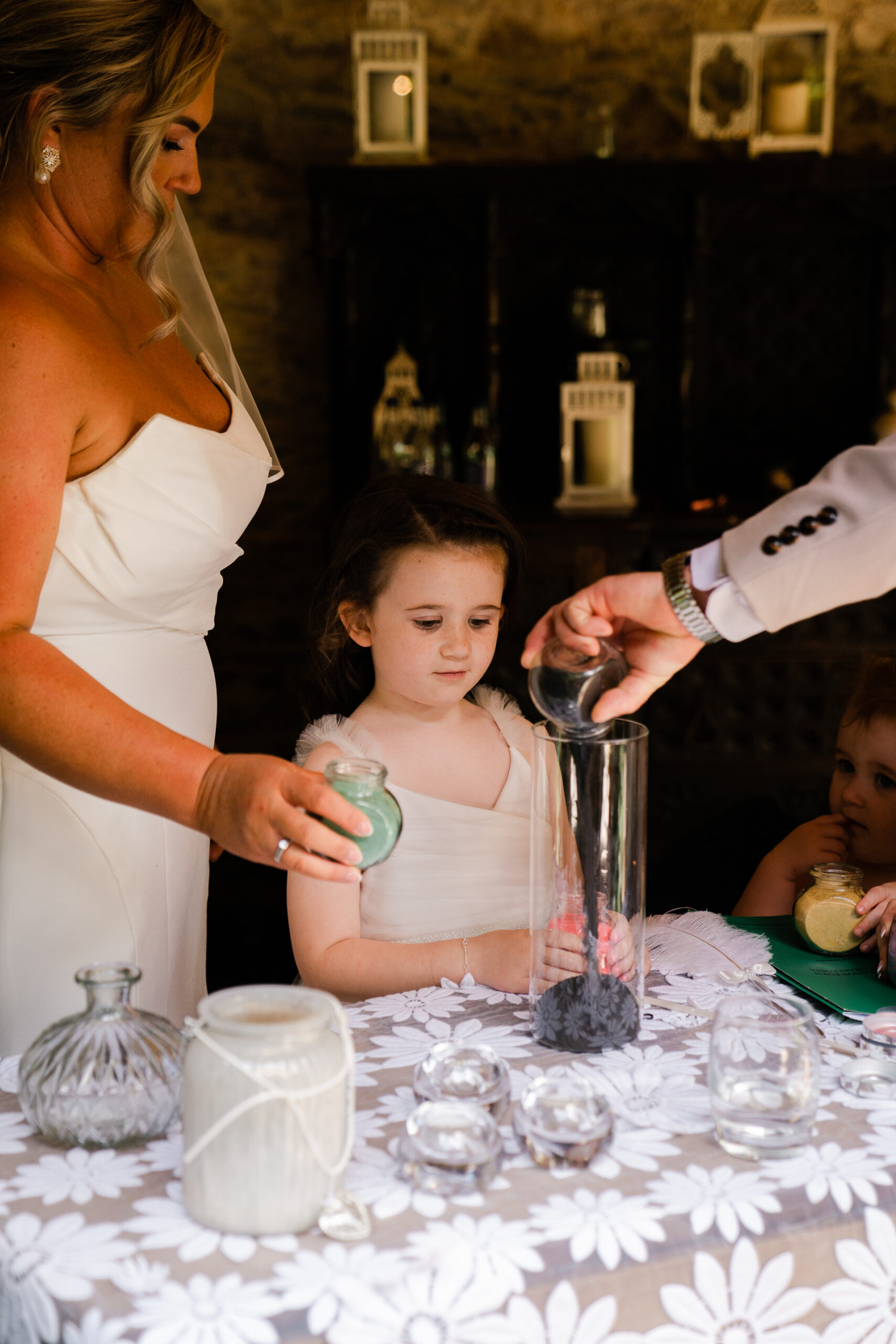 A person pouring a drink into a glass