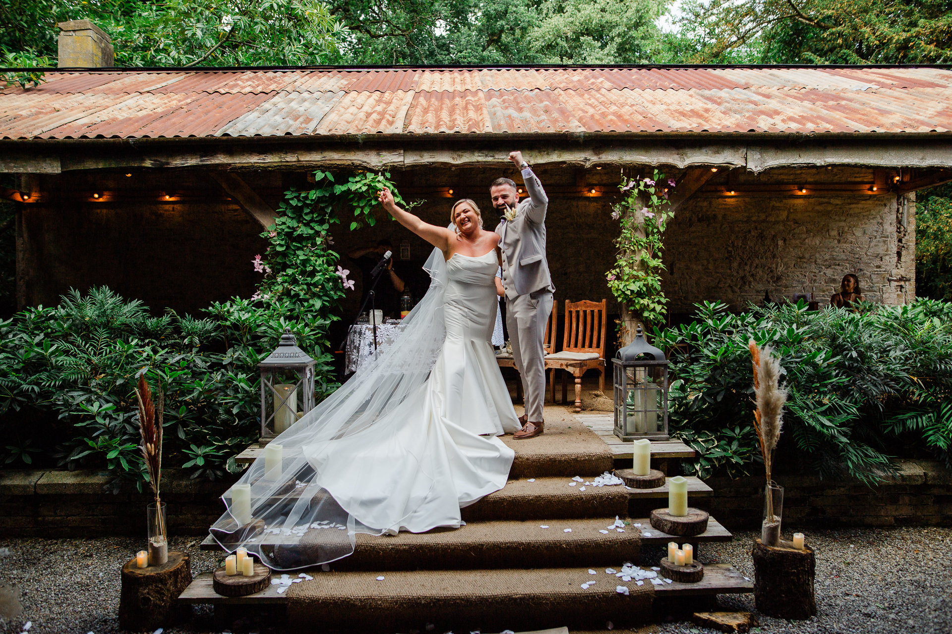 A bride and groom posing for a picture