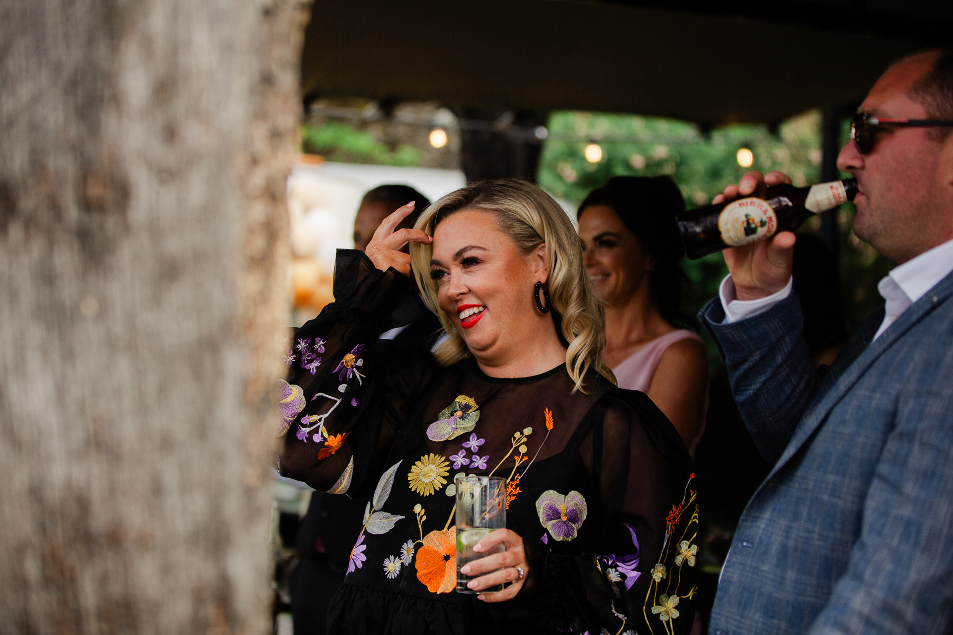 A person drinking from a glass