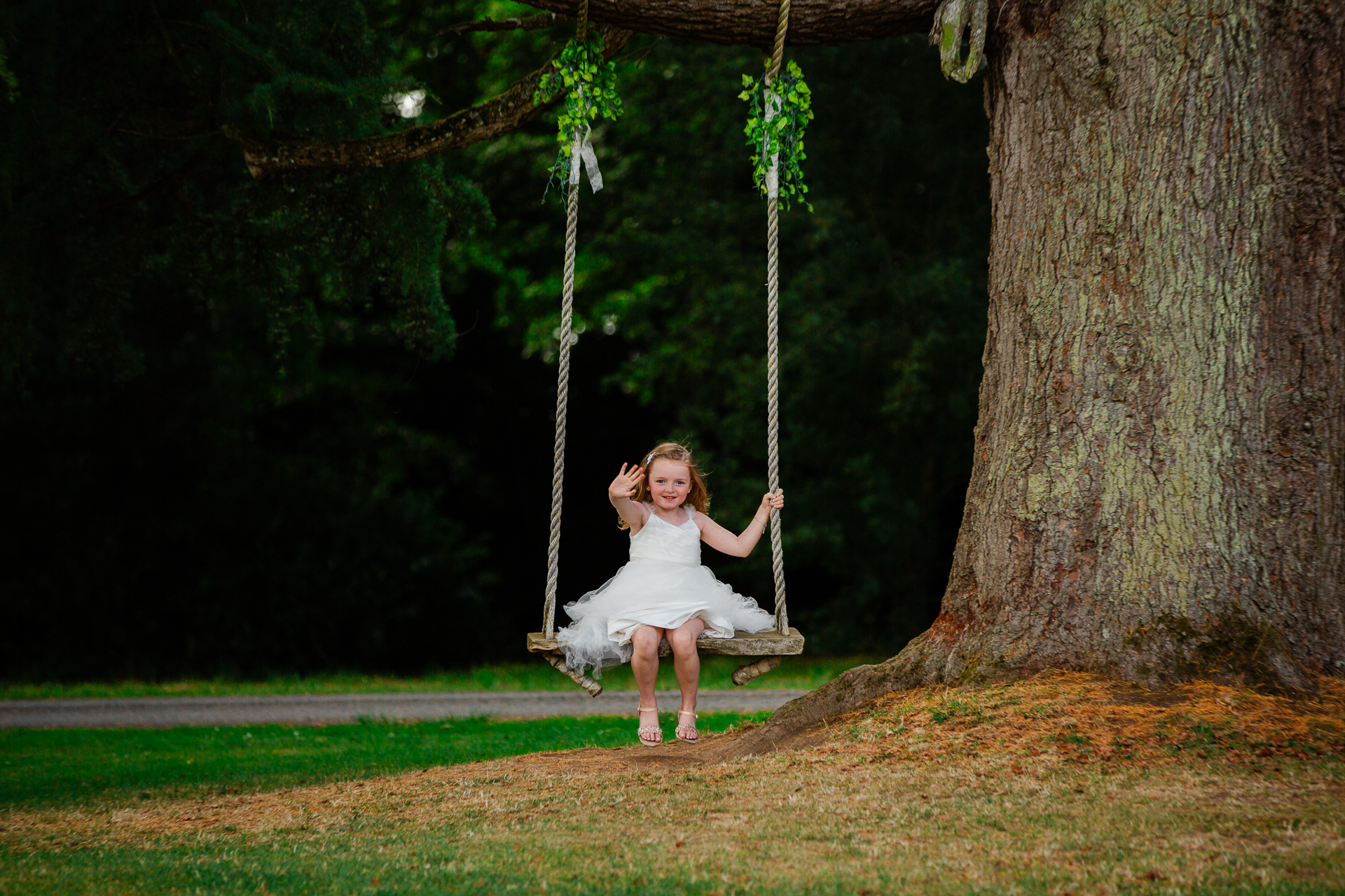 A girl sitting on a swing