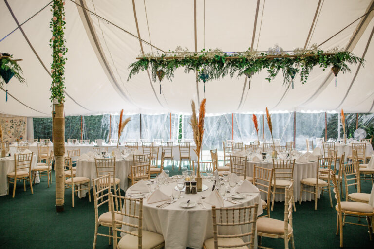 A tent with tables and chairs