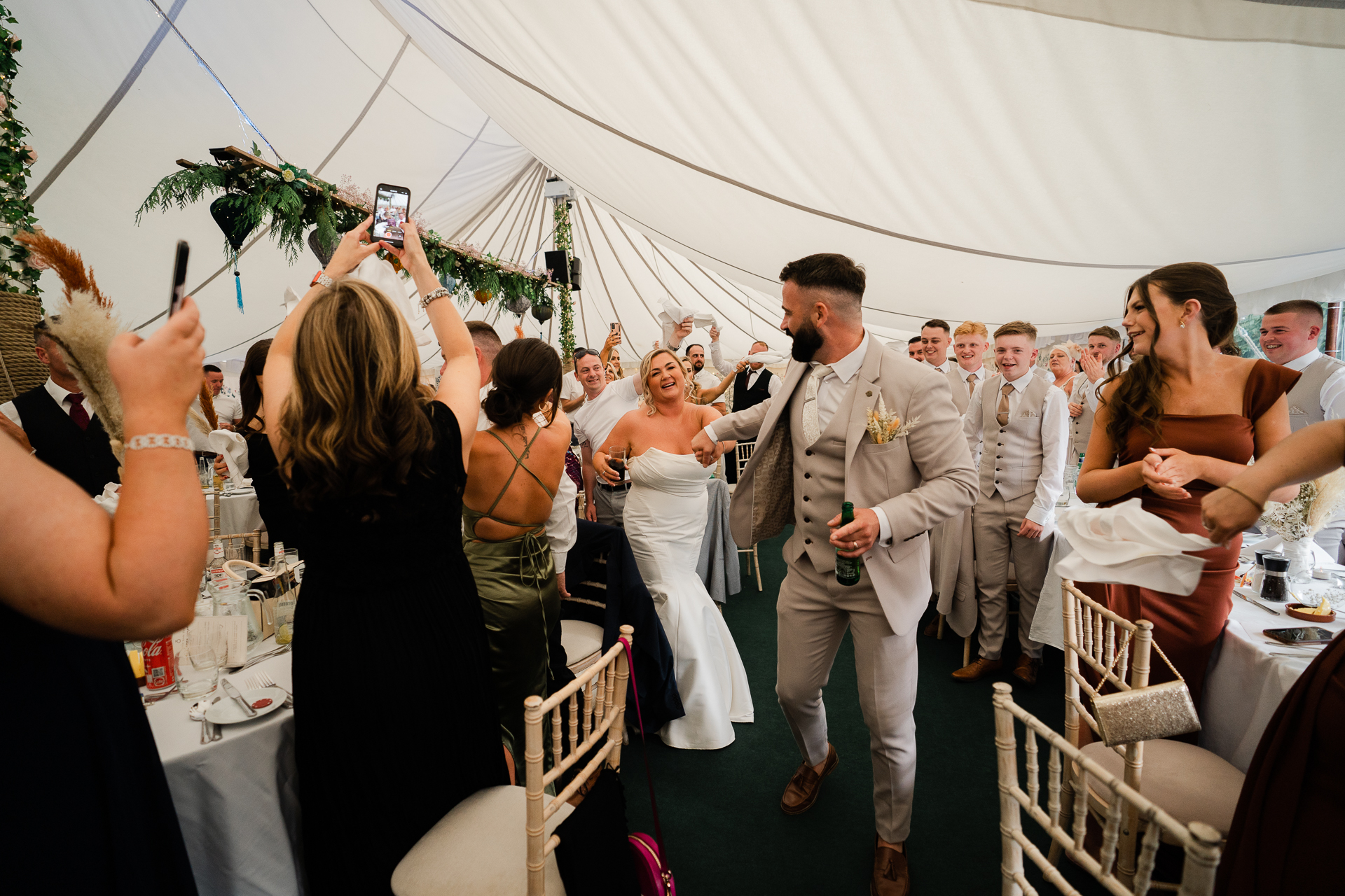 A man and woman walking down a aisle