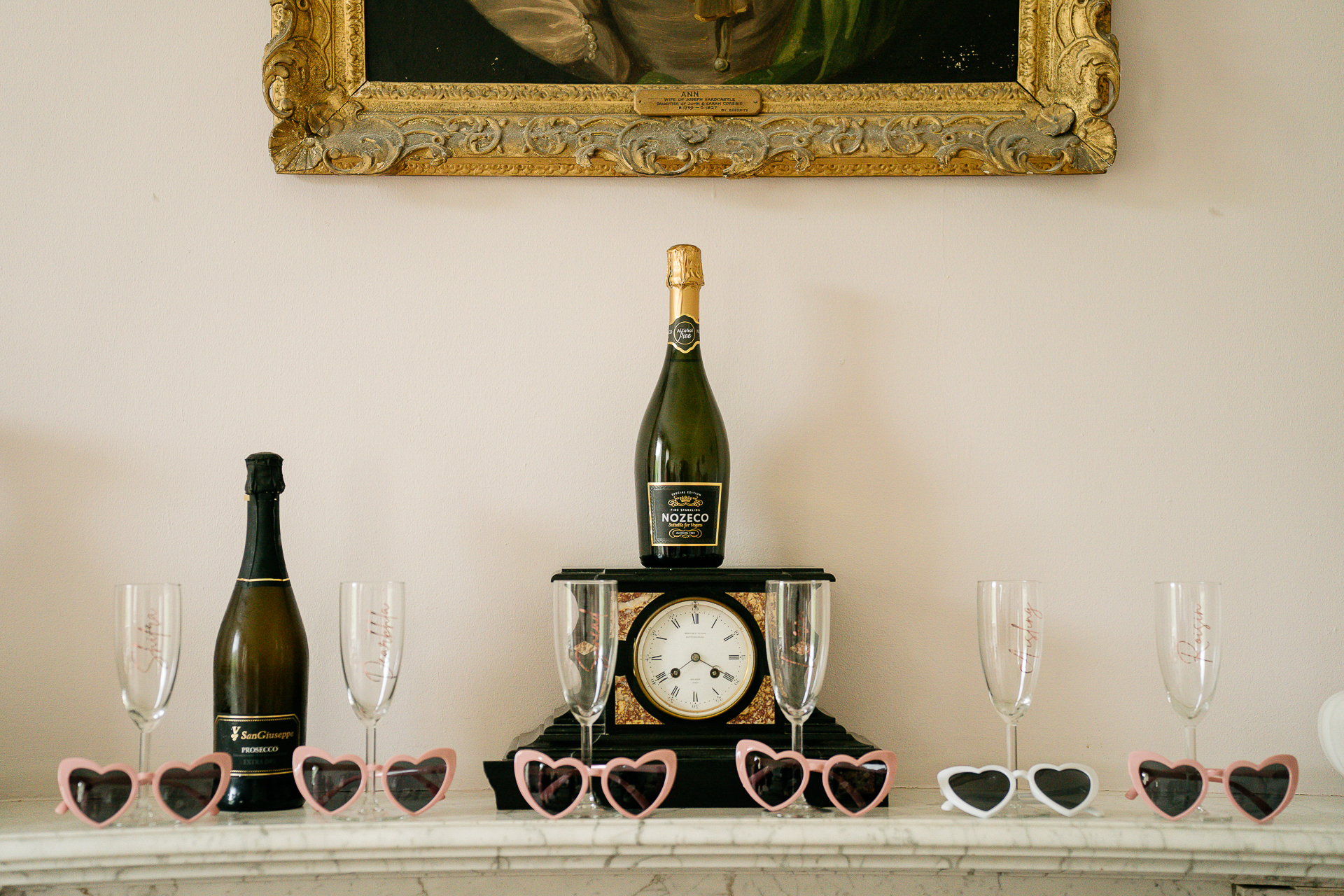 Wine bottles and glasses on a shelf