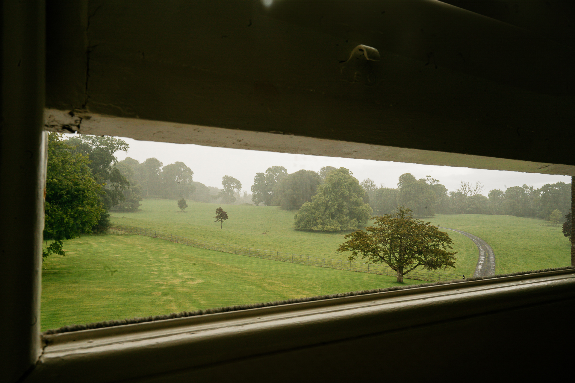 A view of a field through a window