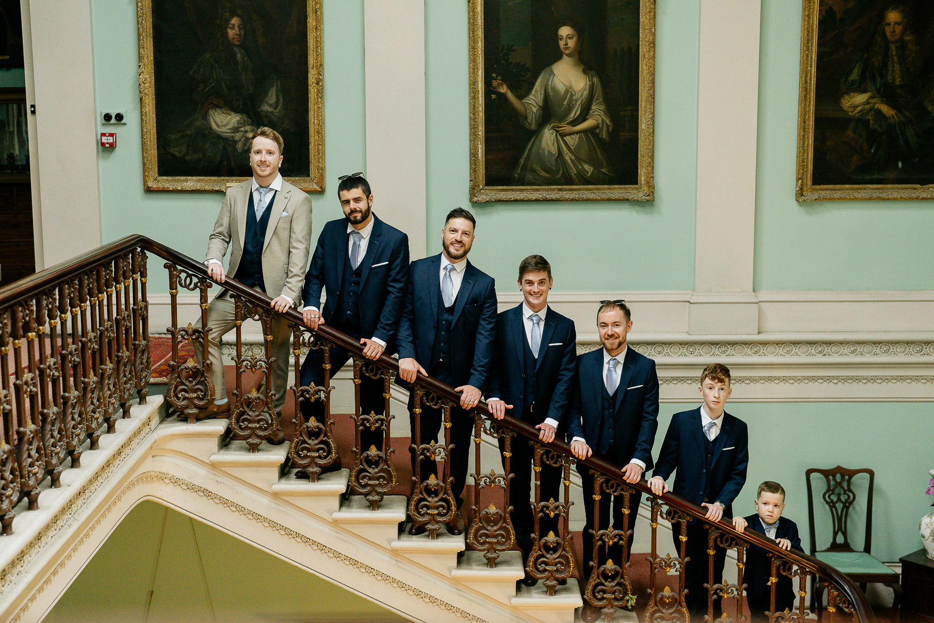 A group of men in suits holding musical instruments