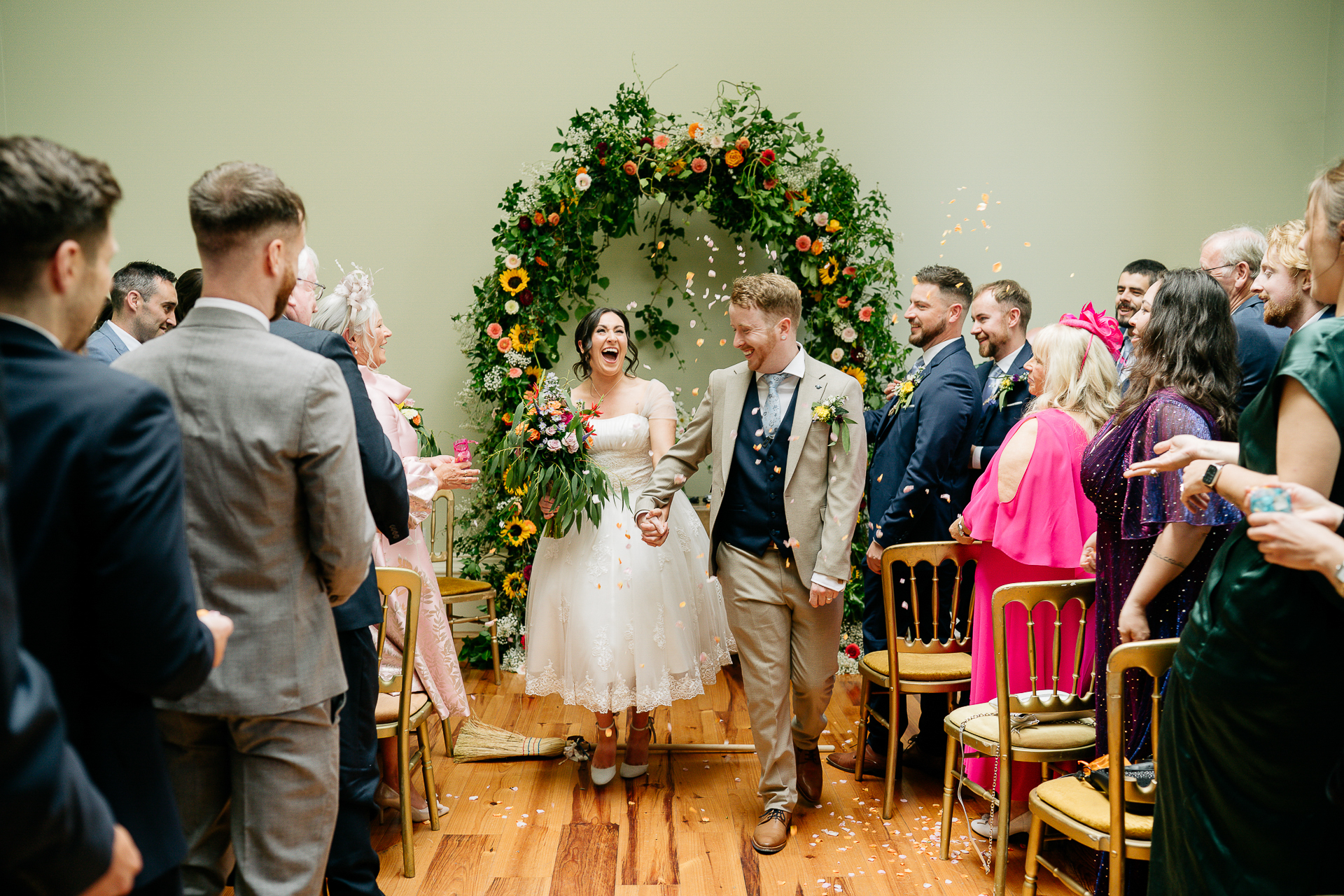 A man and woman walking down a aisle