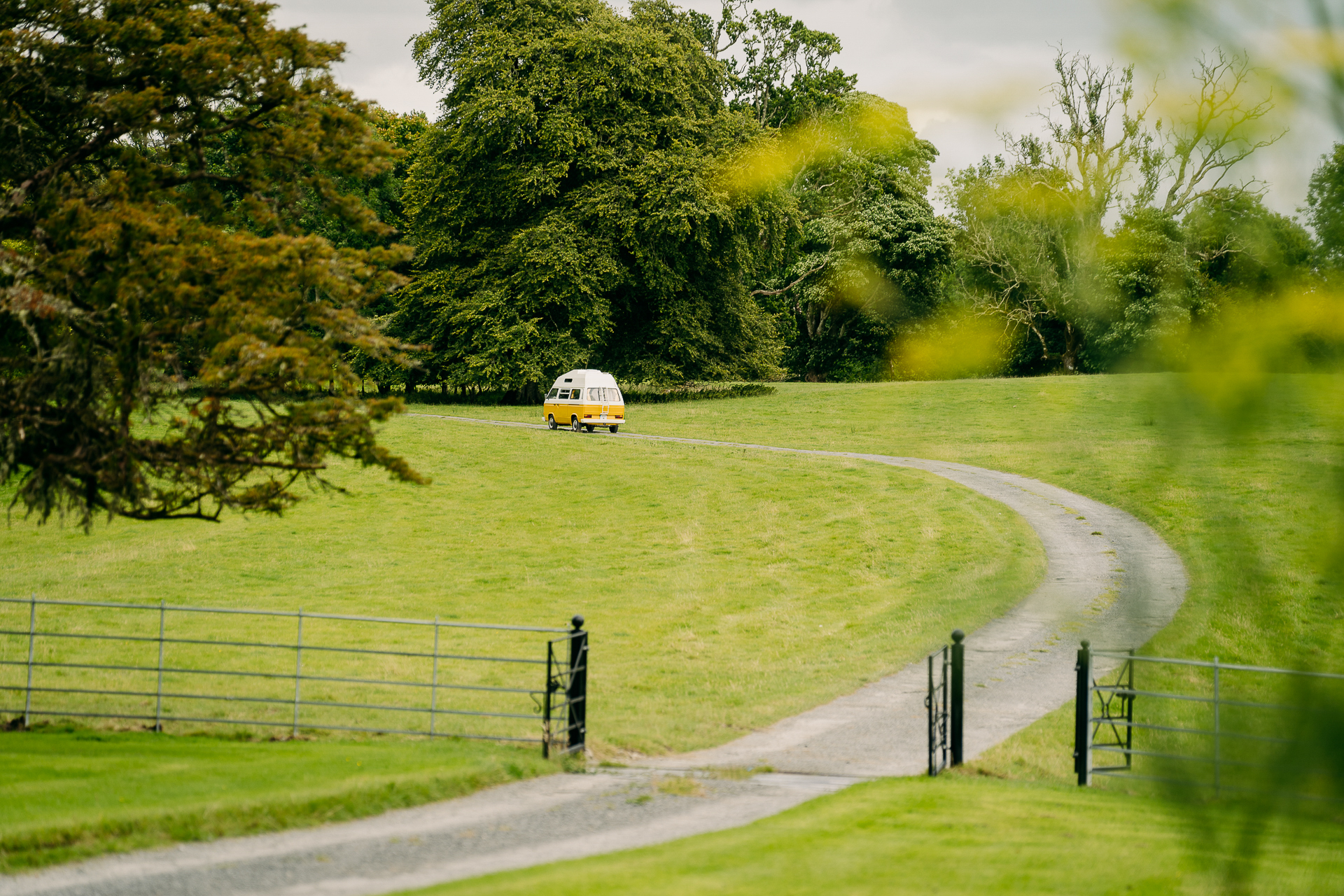 A yellow van on a road