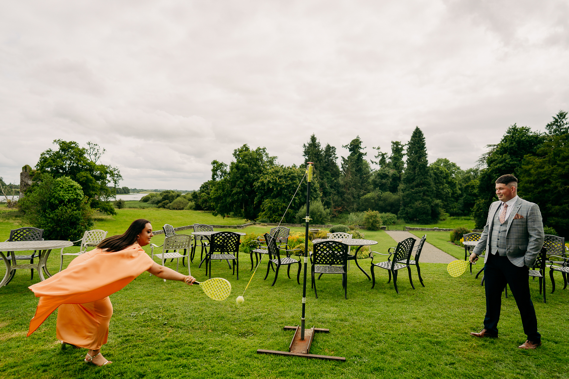 A man and woman playing with a frisbee in a park