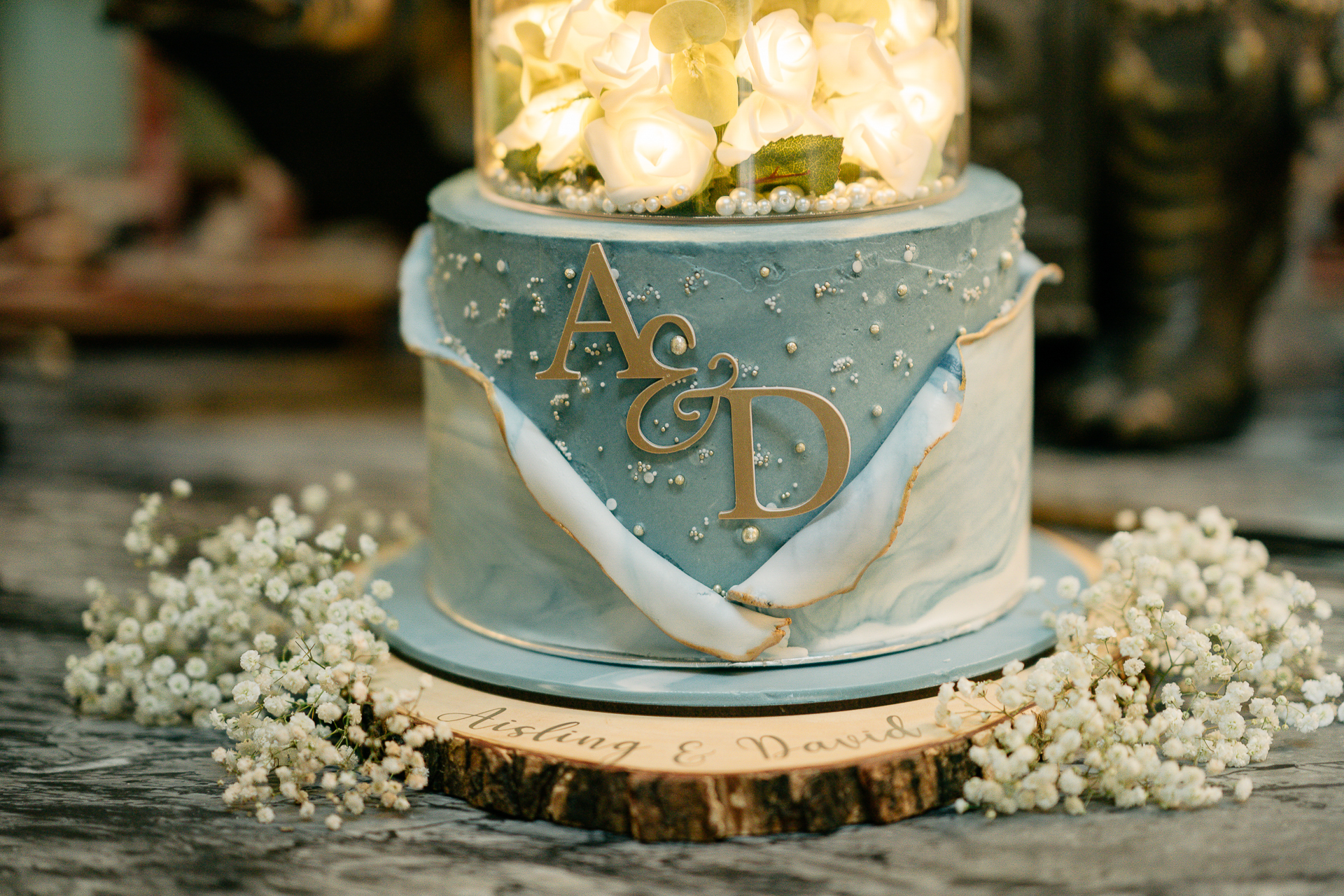 A blue and gold cake with a number on it