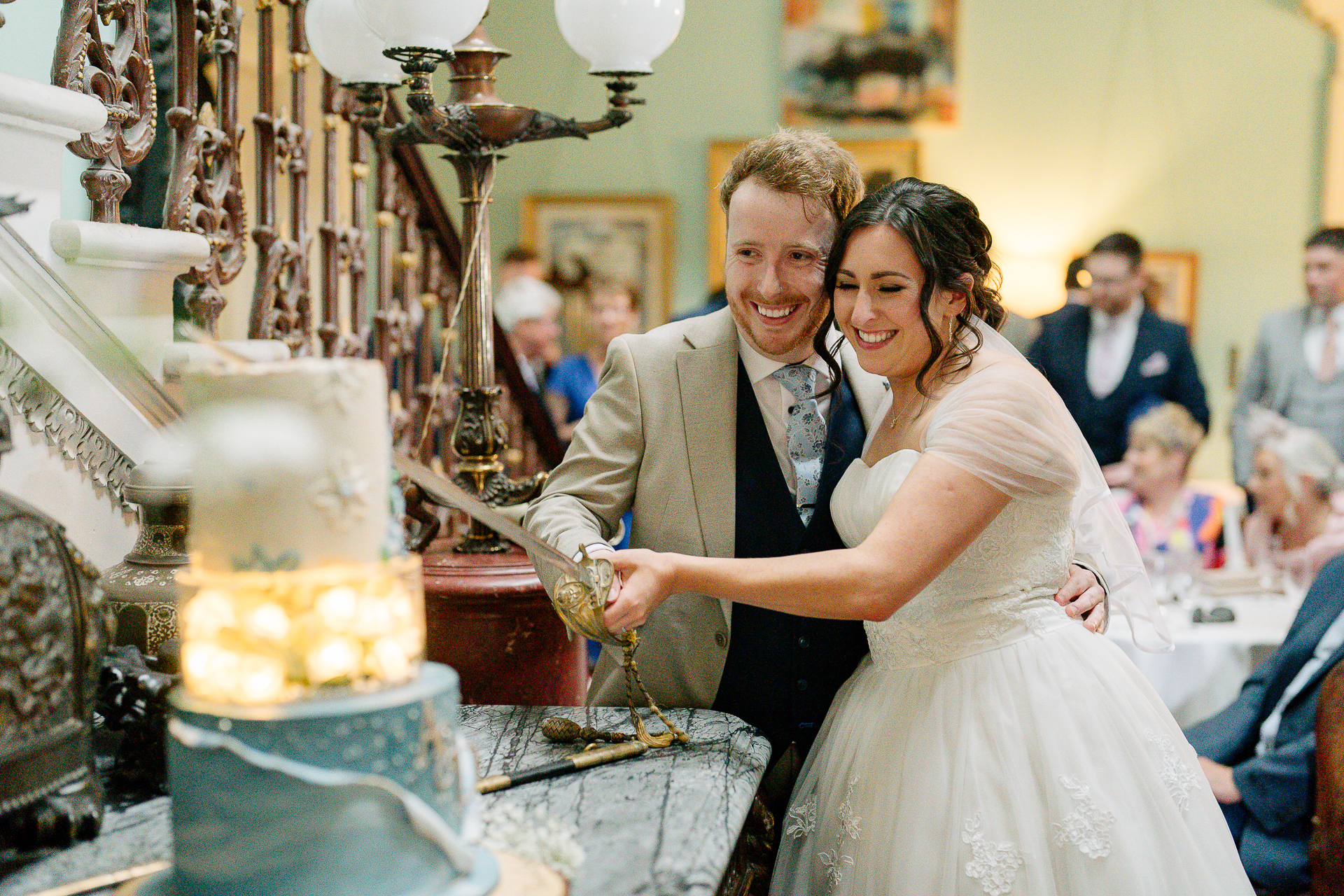 A bride and groom cutting a wedding cake