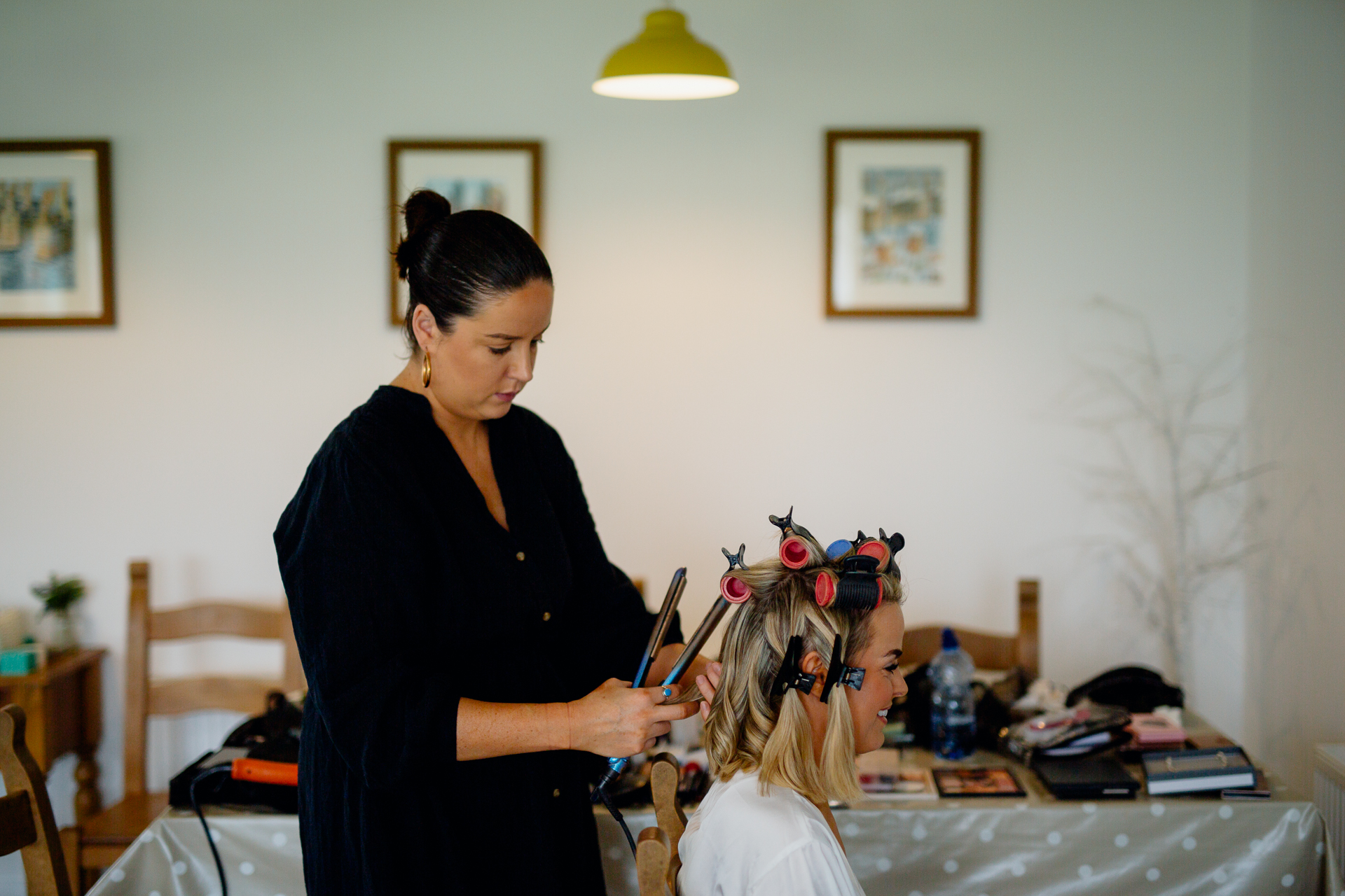 A person cutting a girl's hair