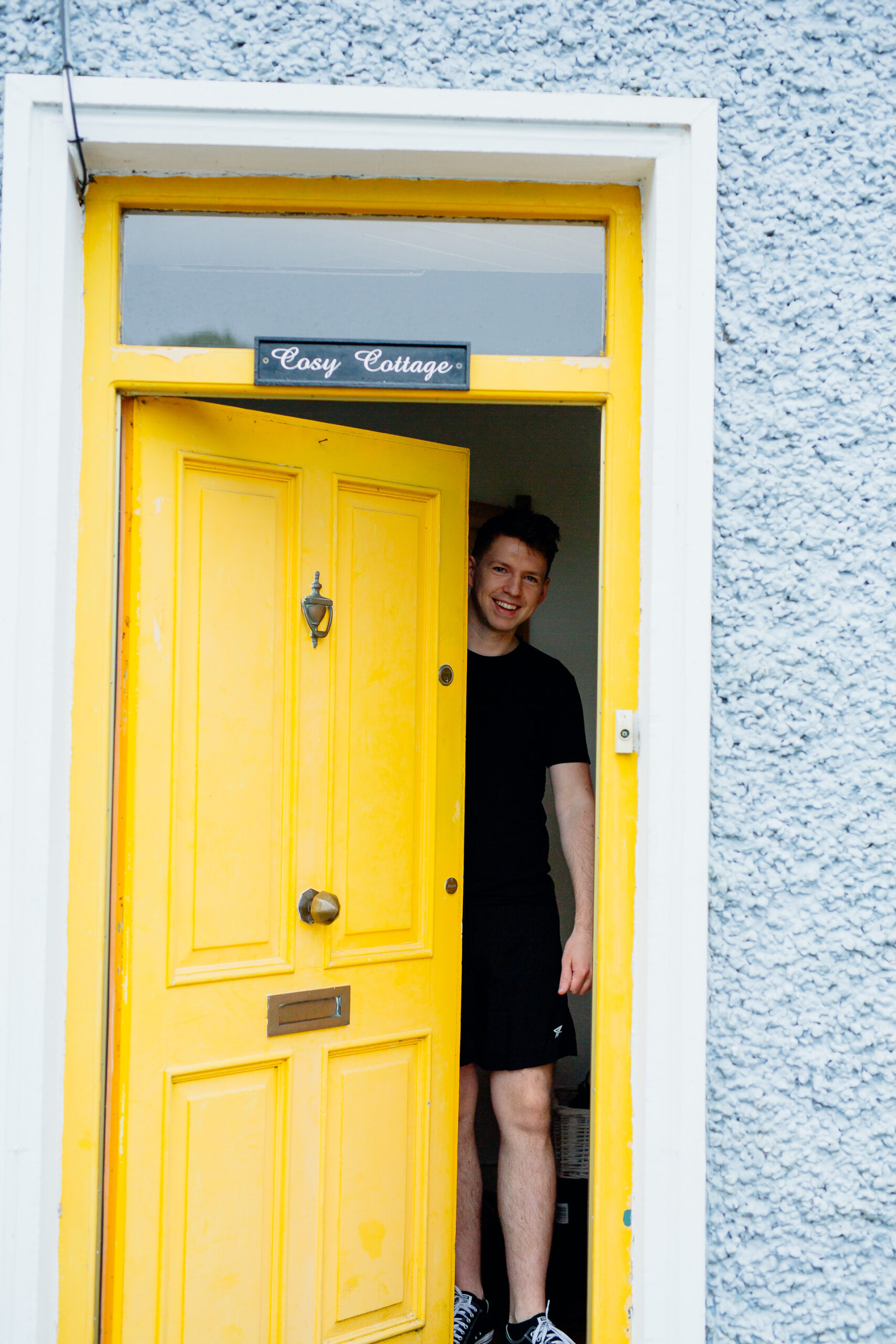 A boy standing in a doorway