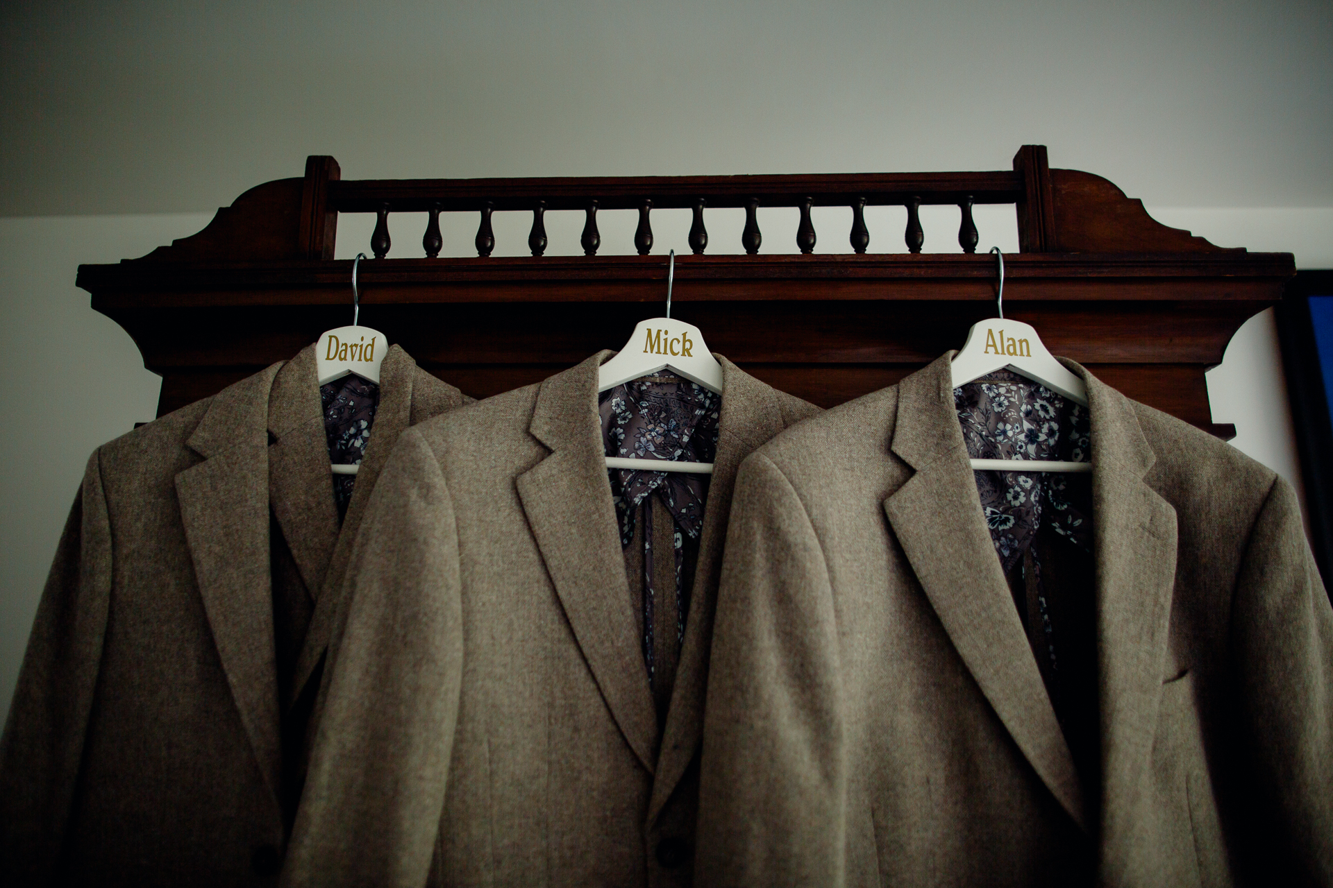 A group of jackets on a rack