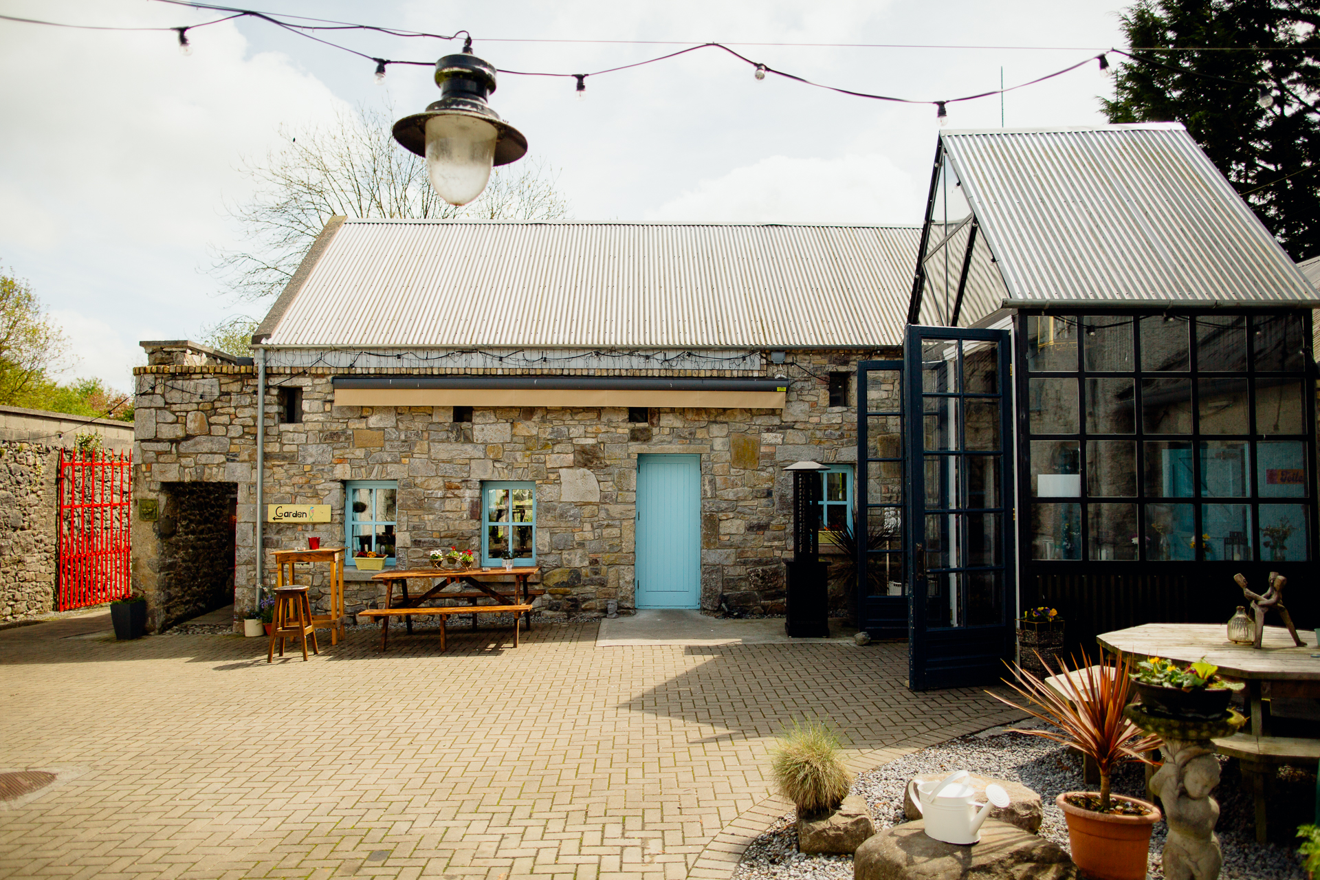 A building with tables and chairs outside