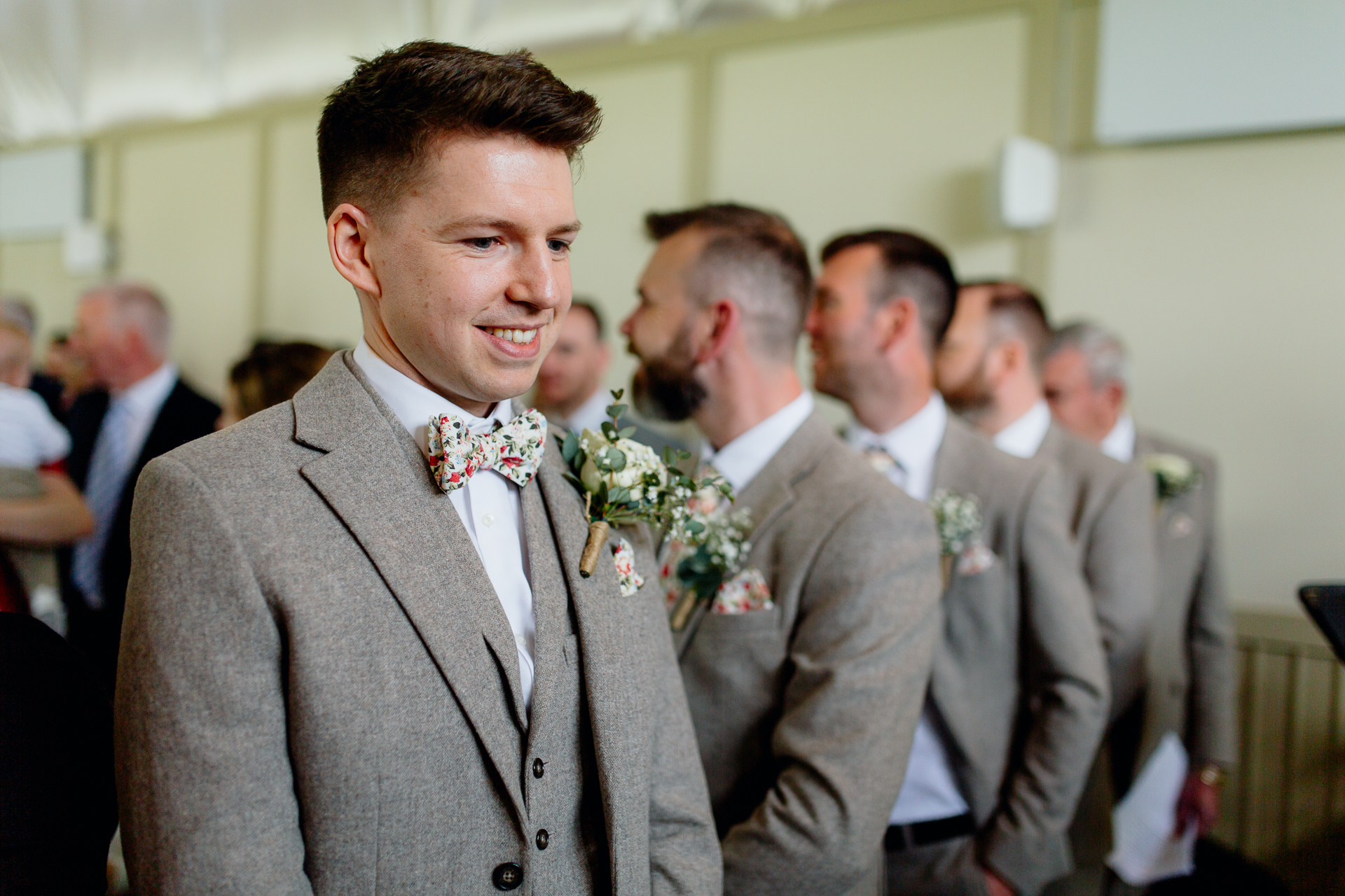 A man in a suit smiling