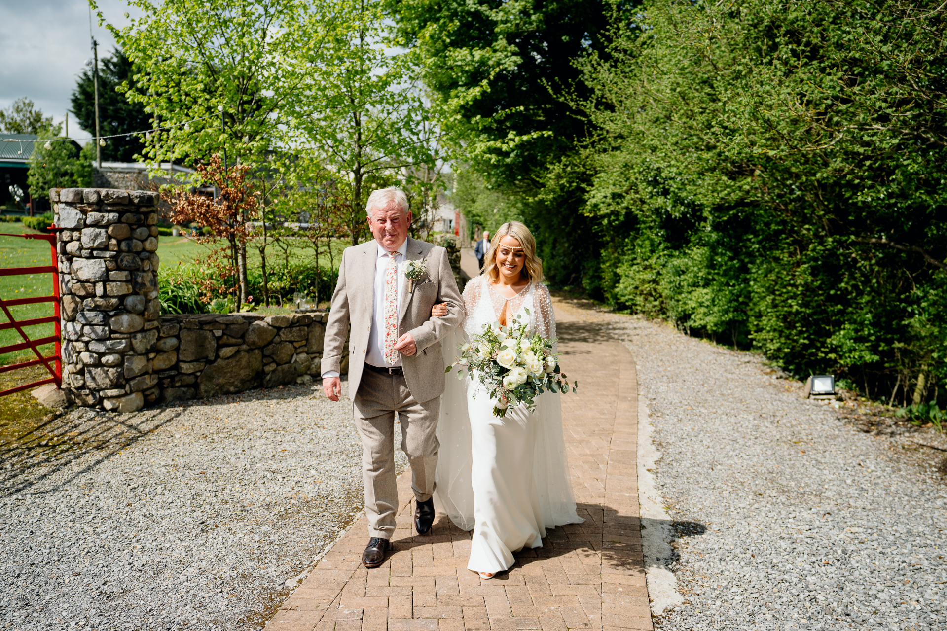 A man and woman walking down a sidewalk