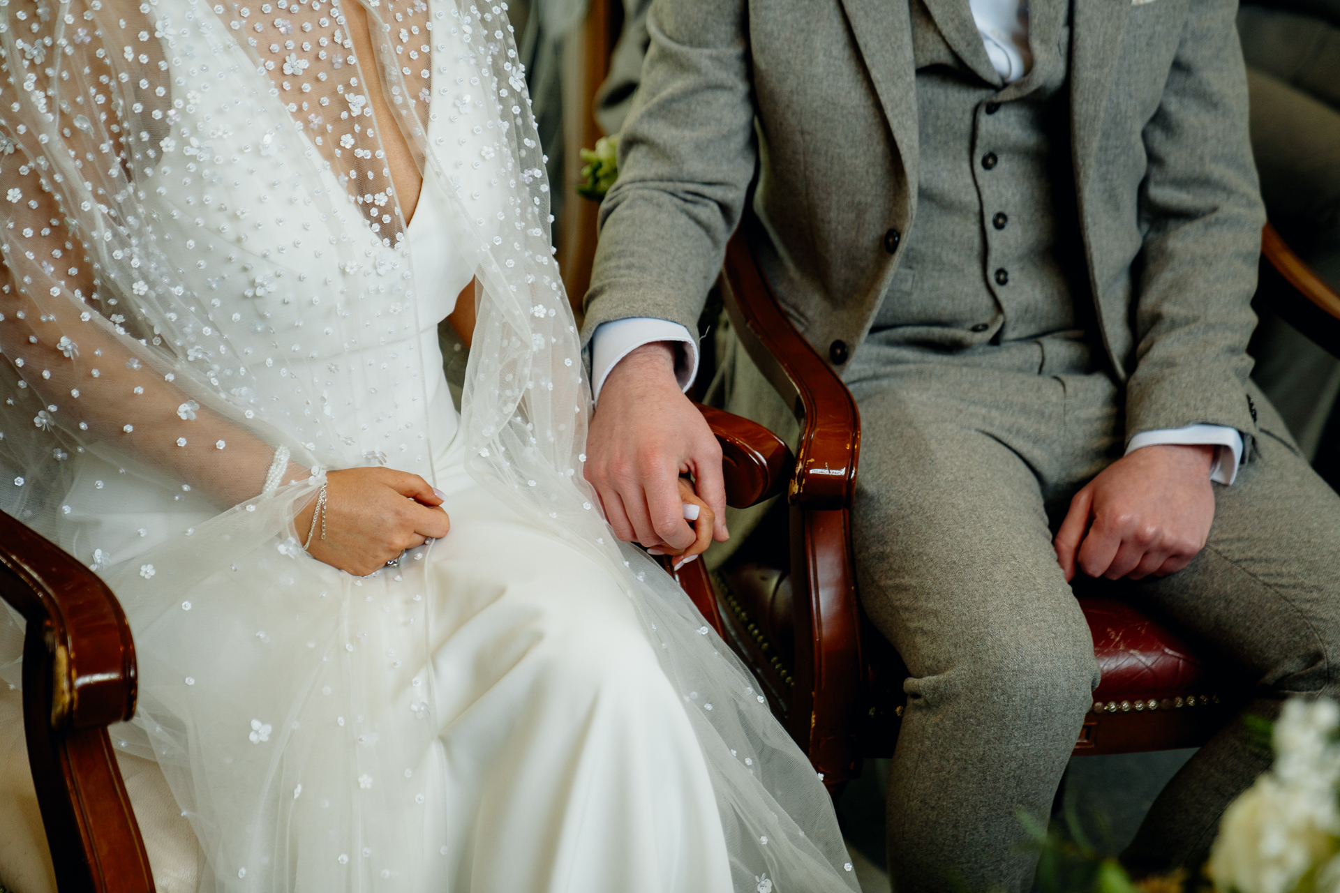 A man and woman holding hands