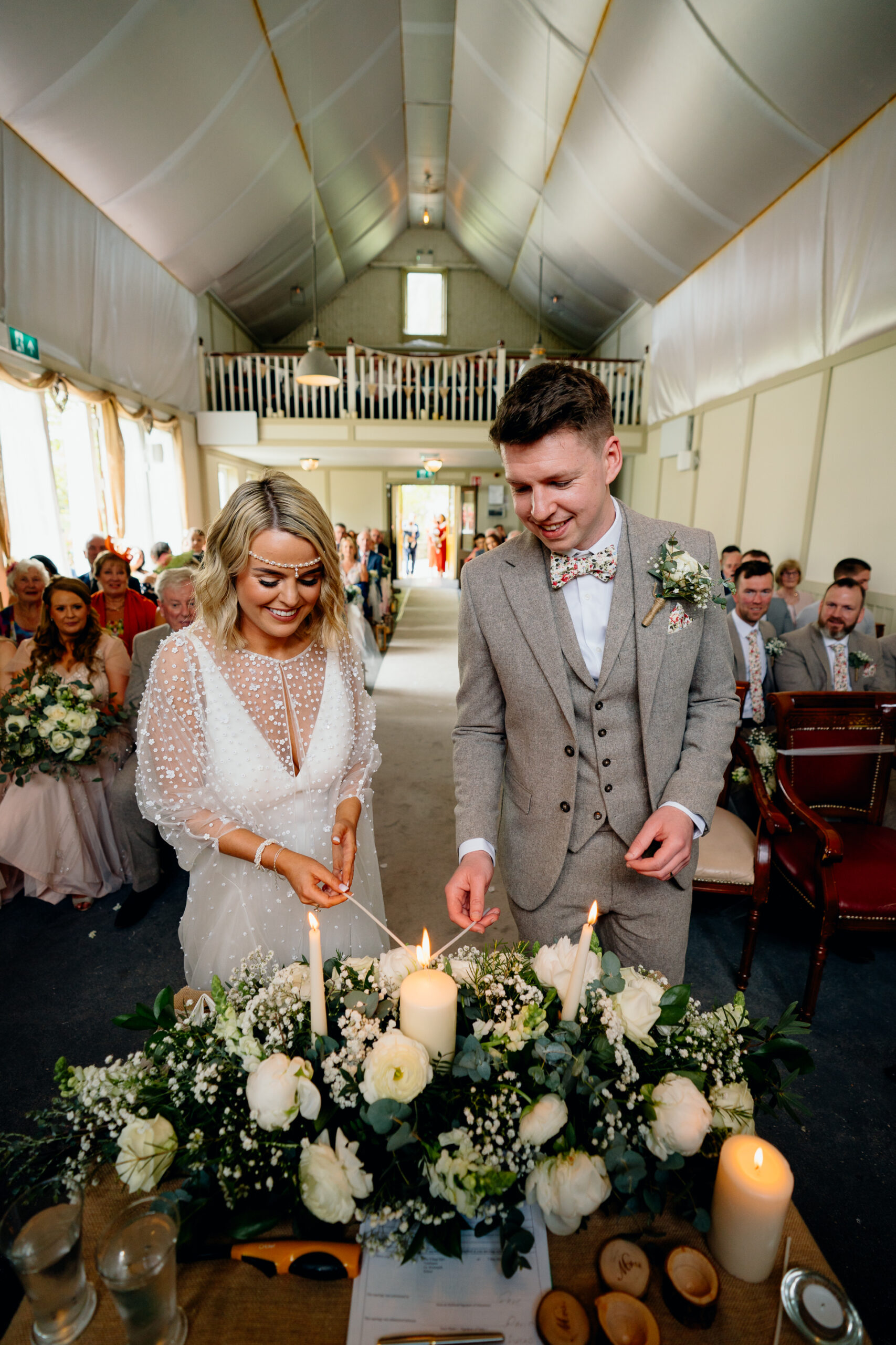 A man and woman holding candles