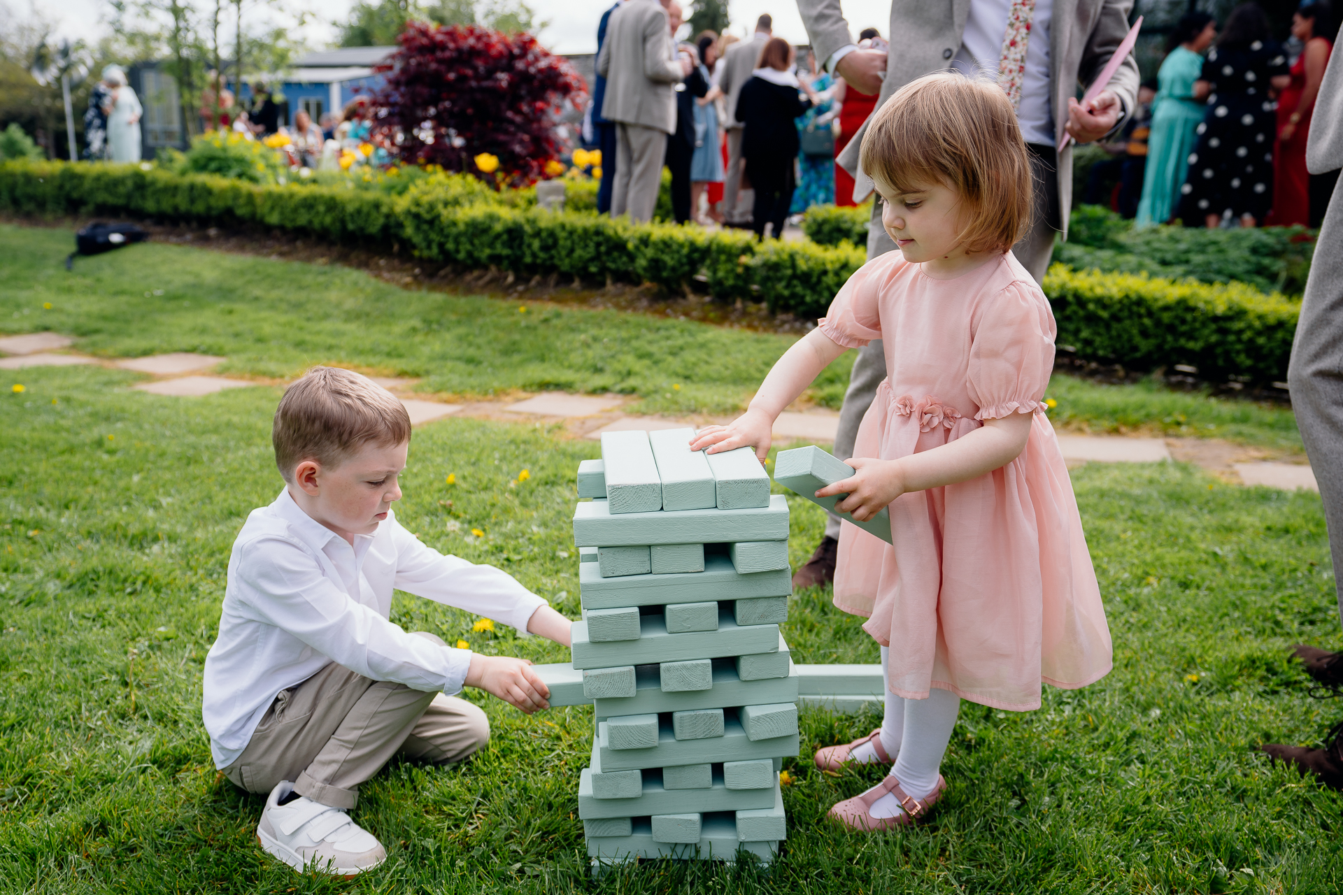 A couple of children playing with blocks