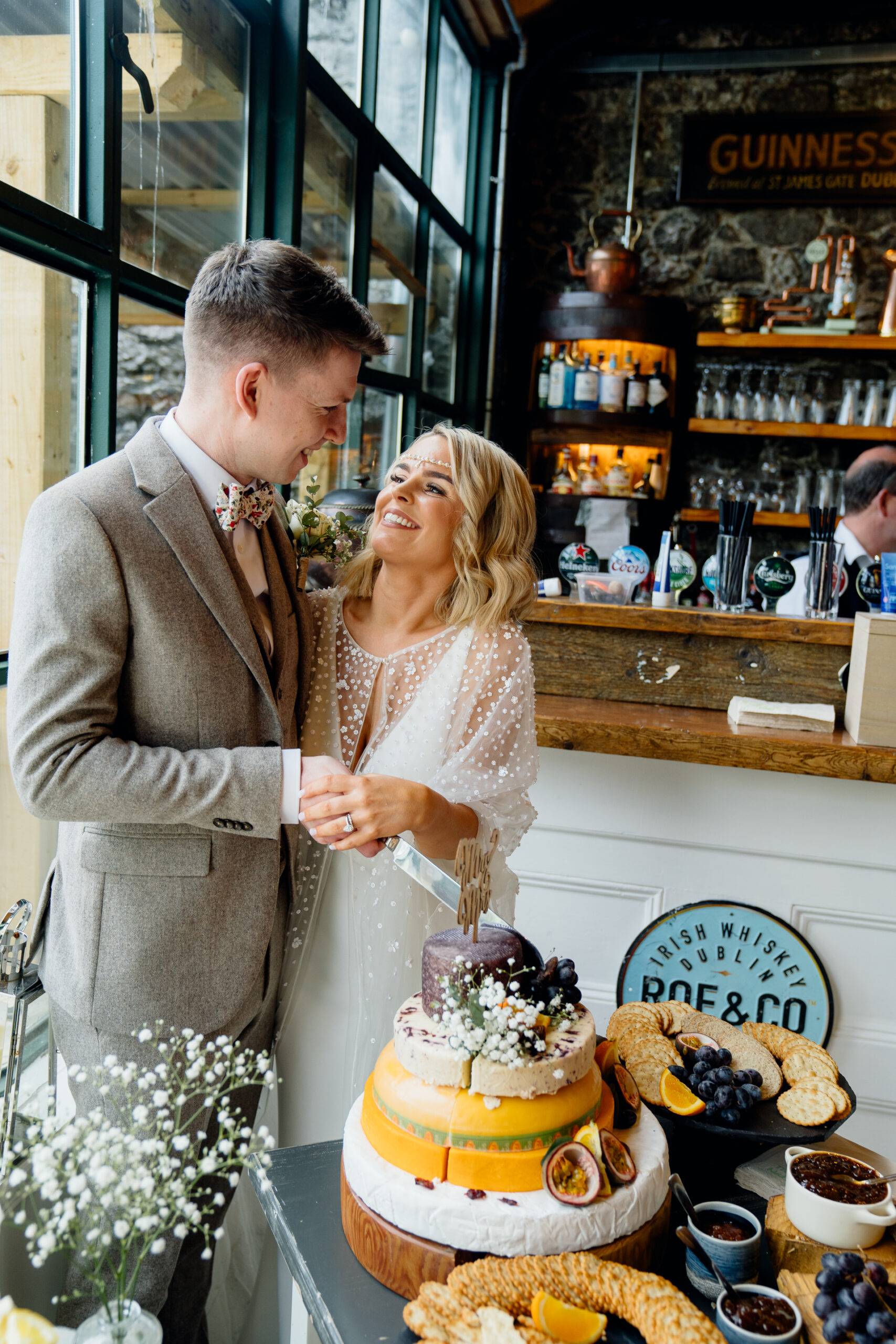 A bride and groom cutting a cake