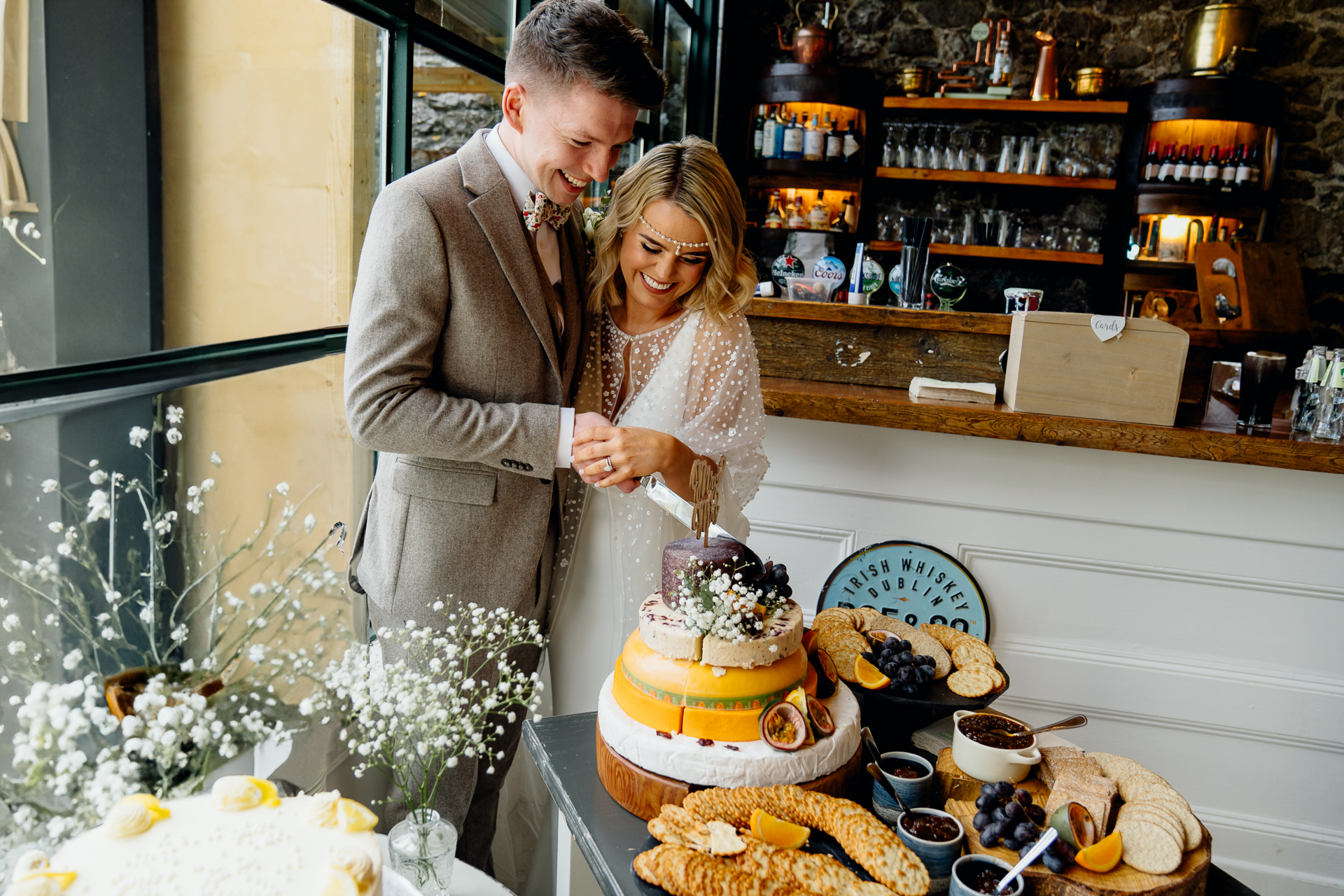 A couple cutting a cake