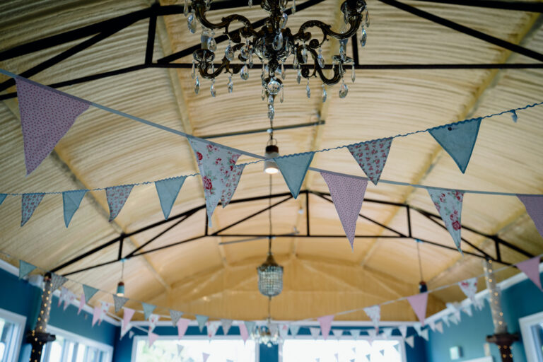 A chandelier with many colorful paper from it