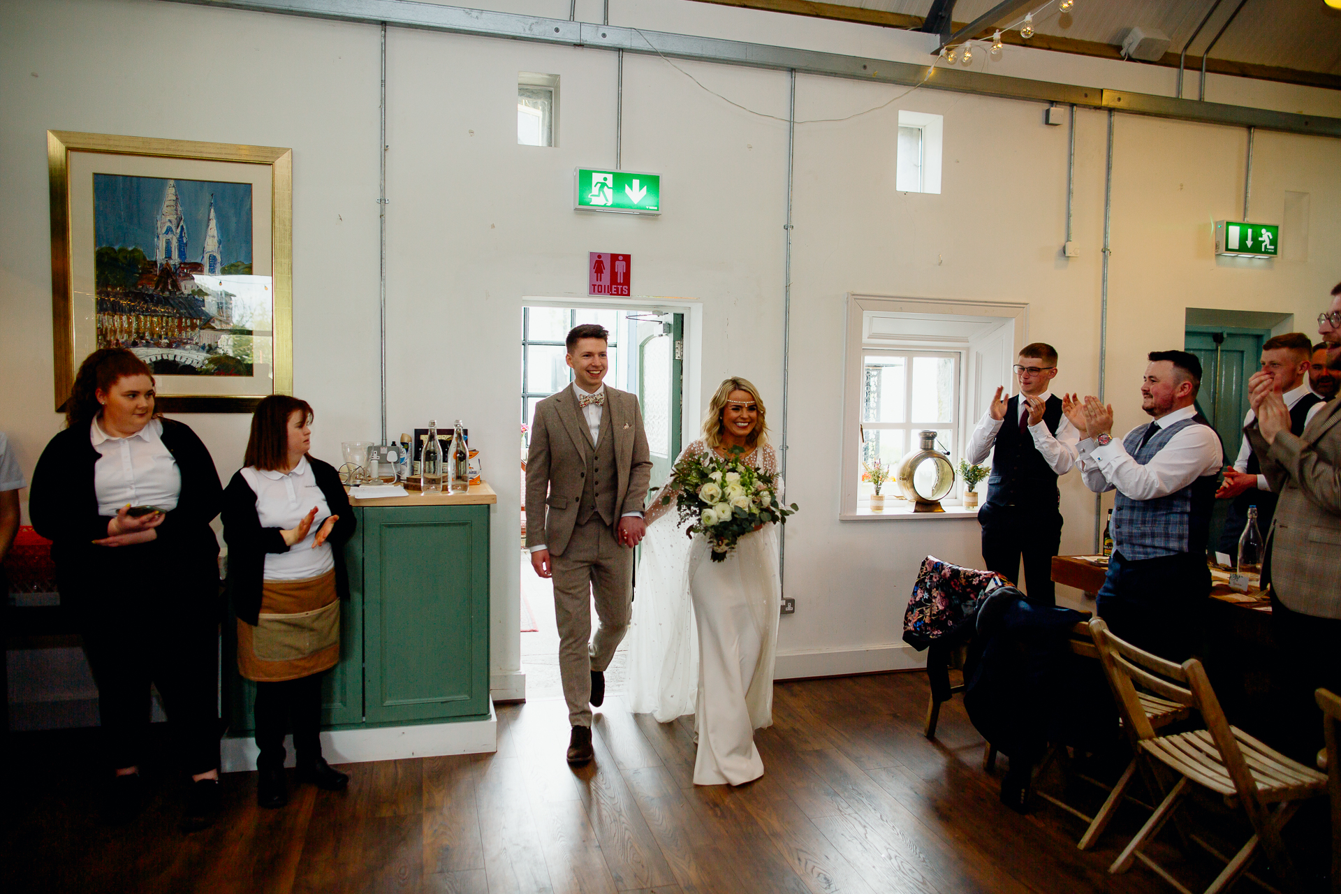 A bride and groom walking down the aisle