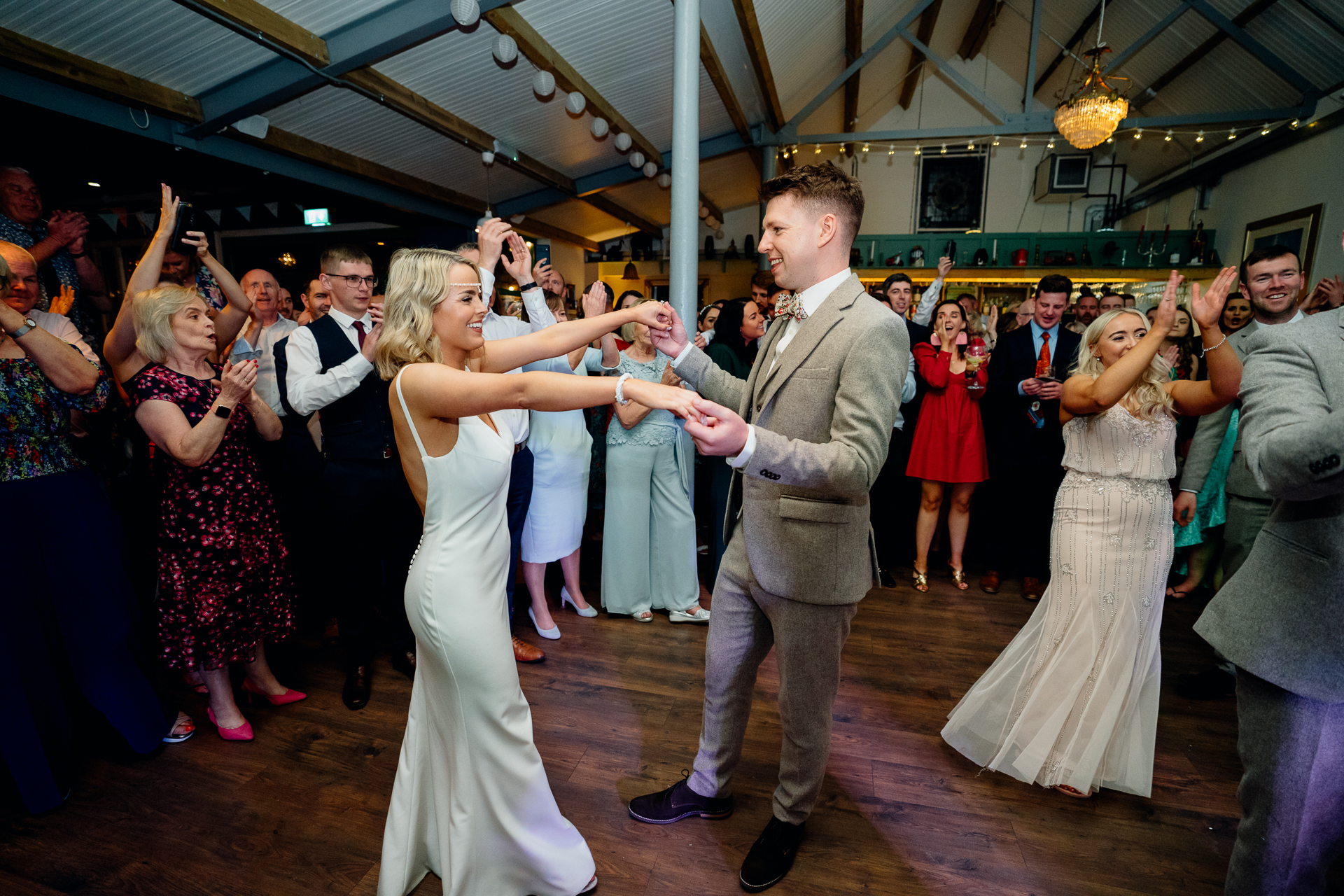 A man and woman dancing at a wedding reception