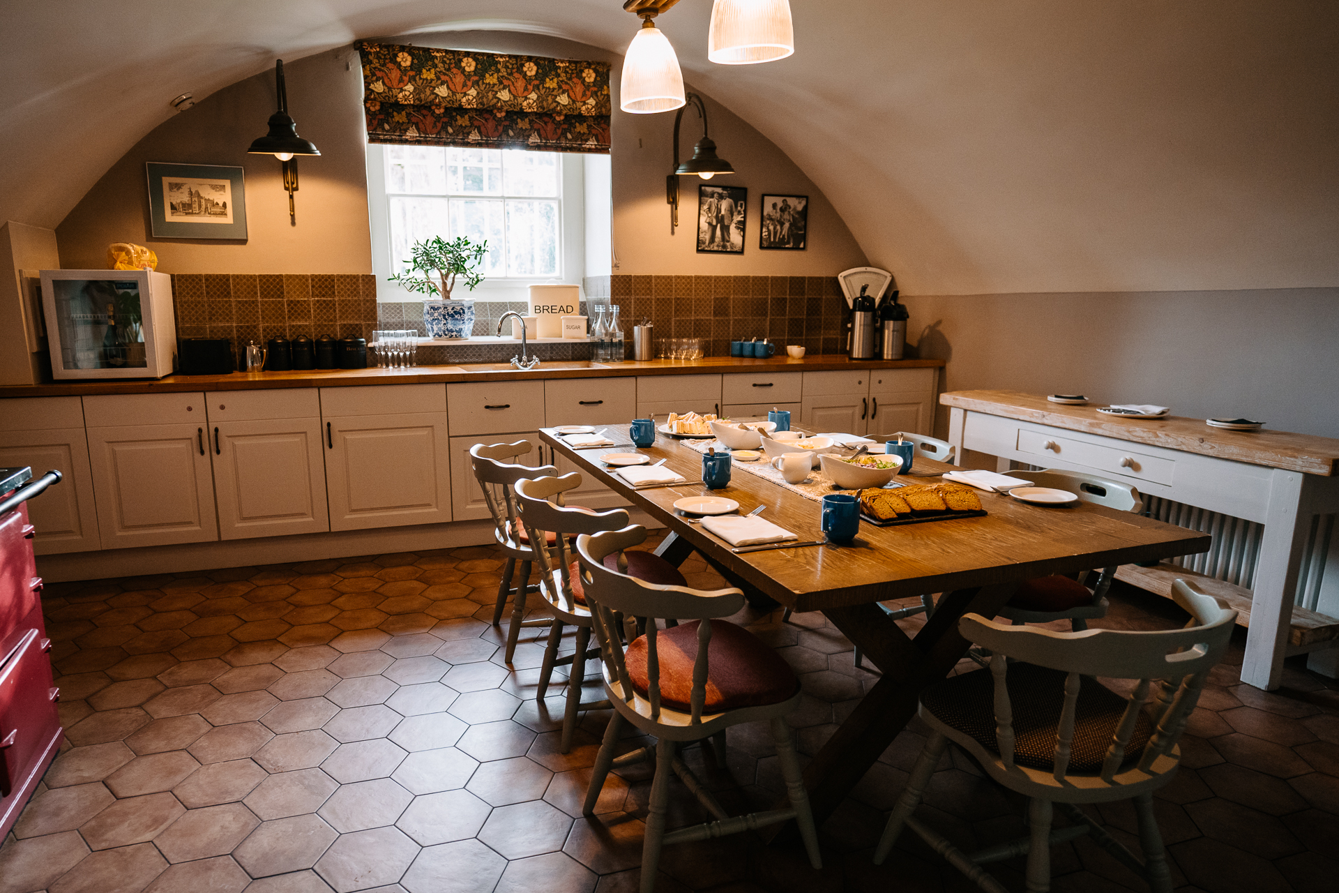 A kitchen with a table and chairs