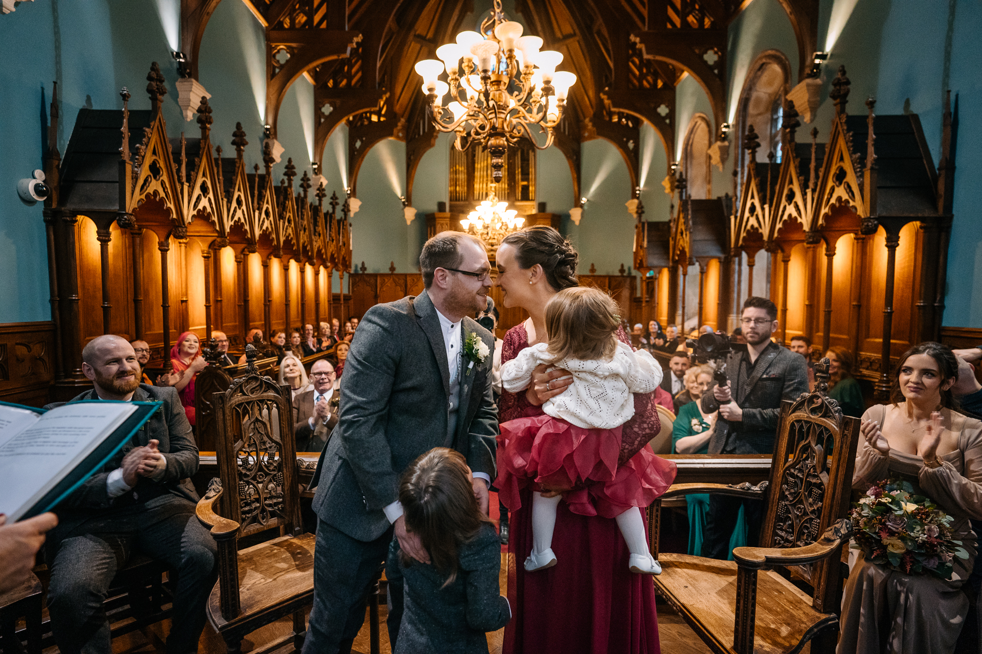 A man and woman holding hands in a church