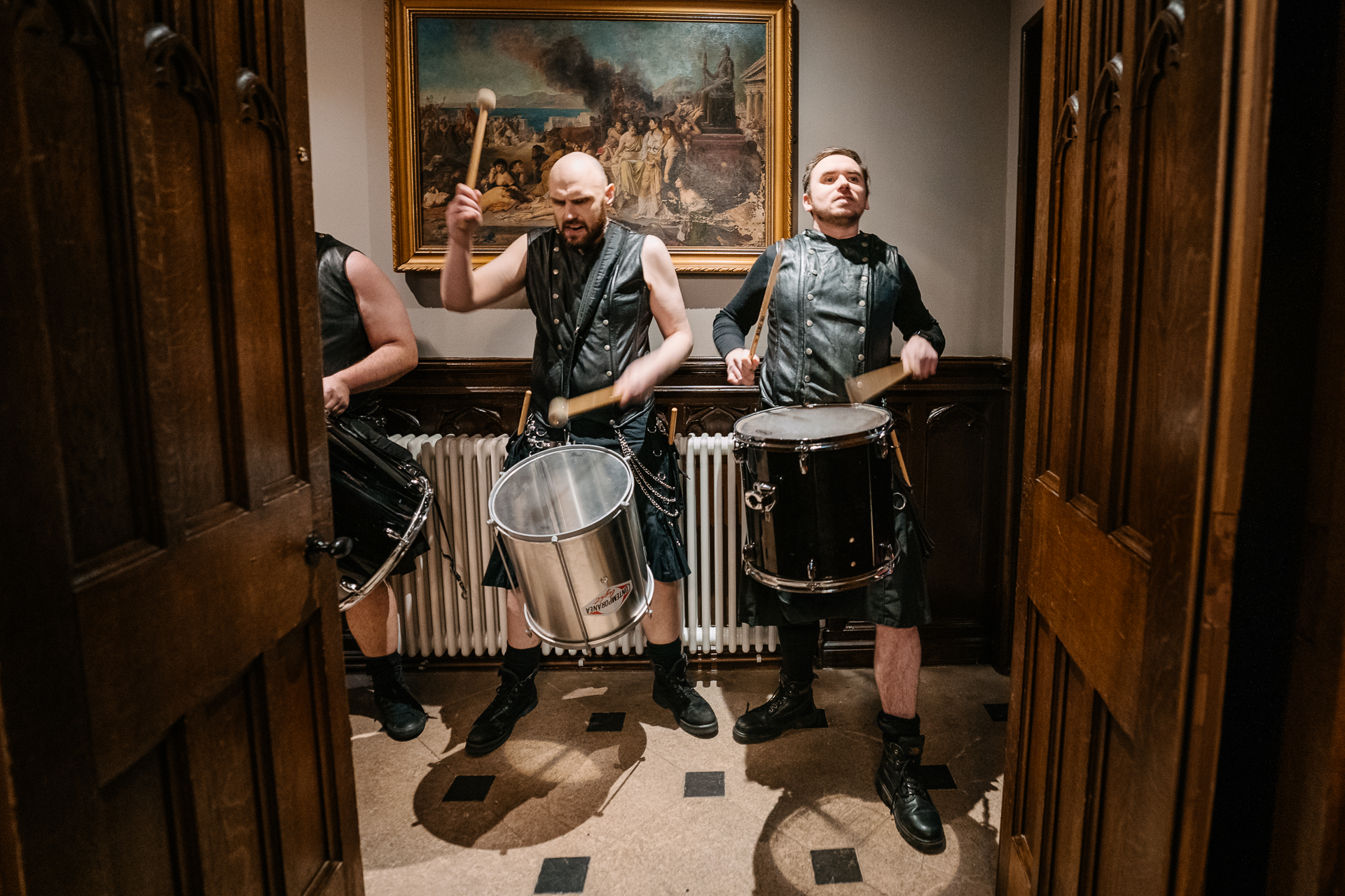 A group of men playing drums