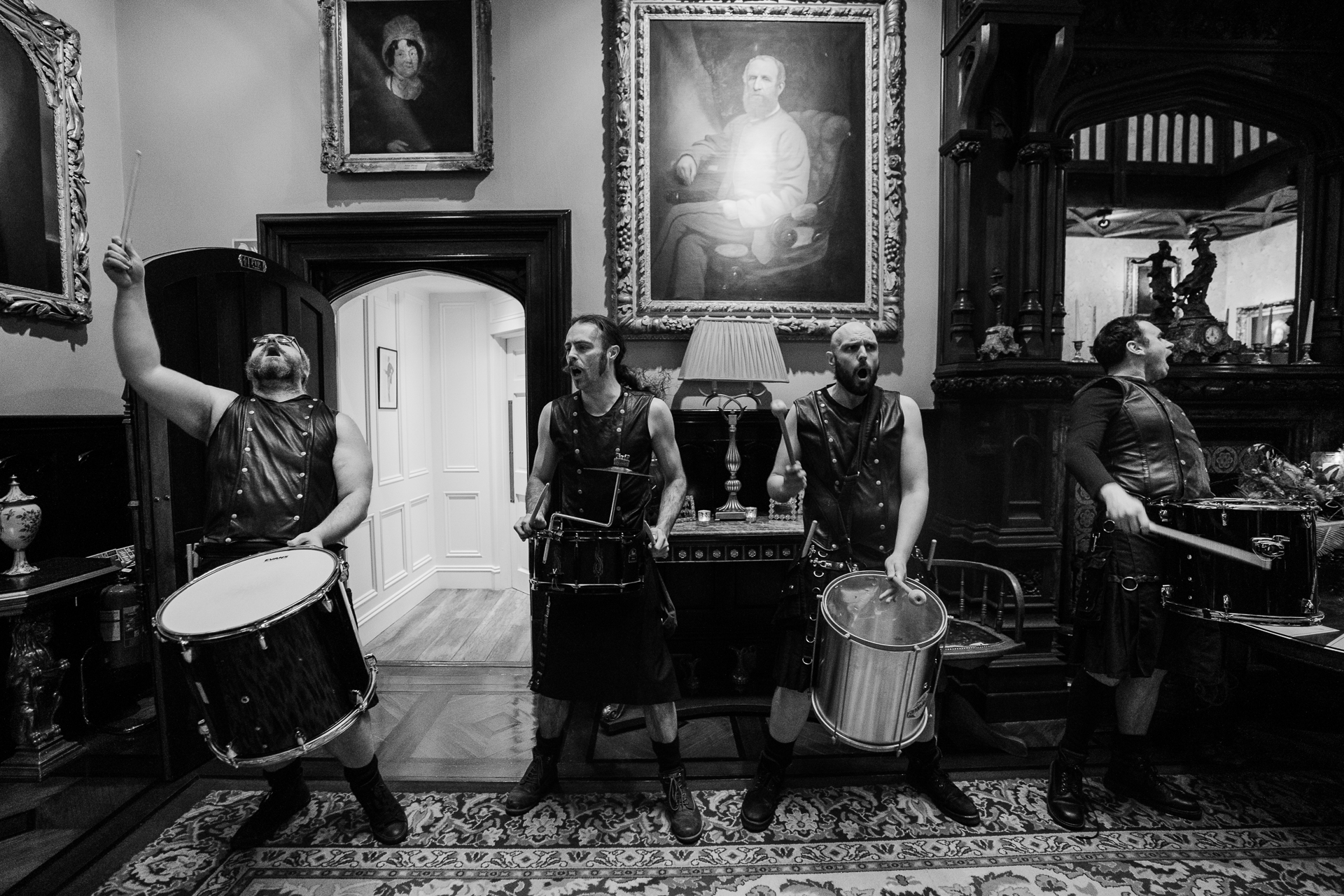 A group of men playing drums