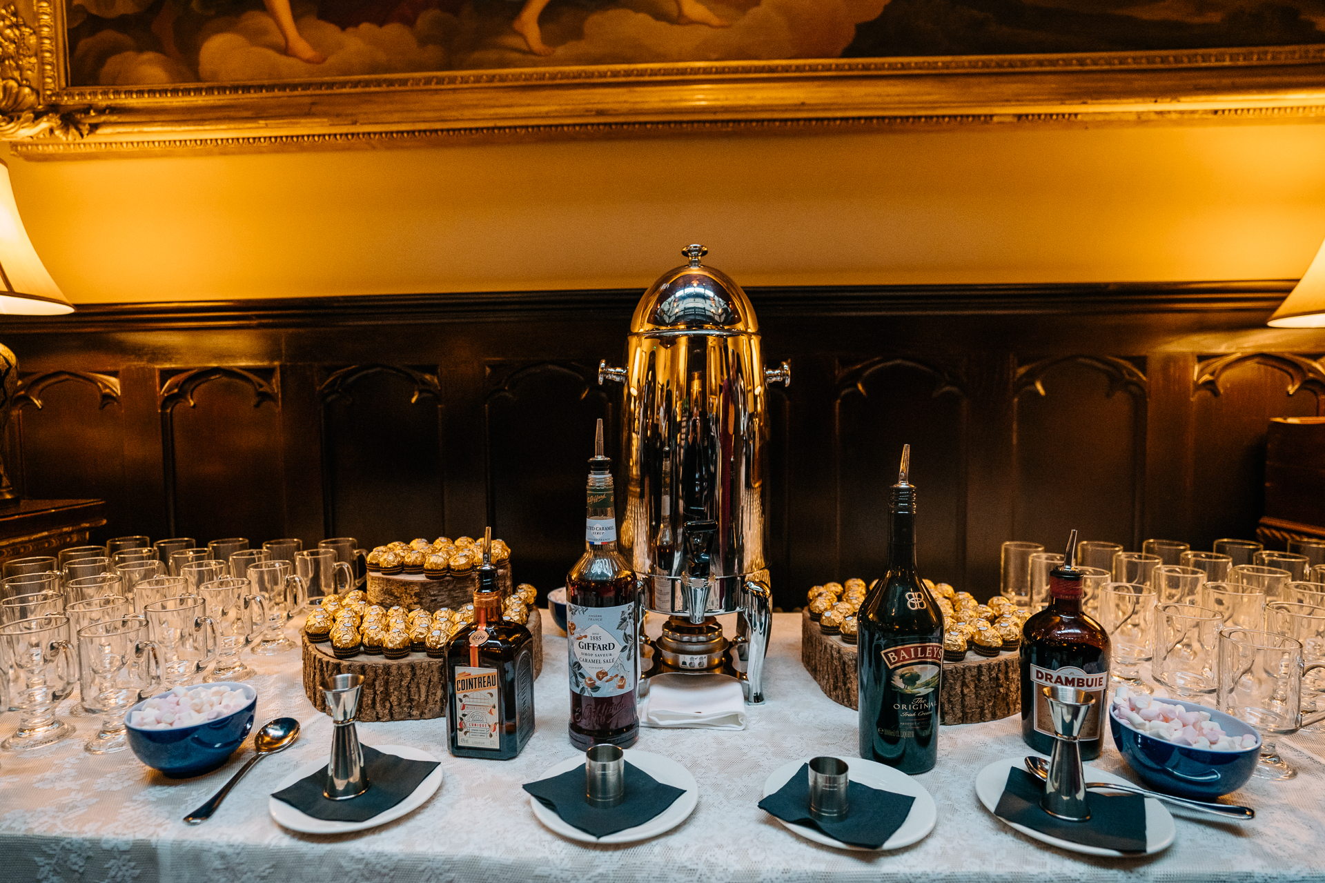 A table with bottles and glasses