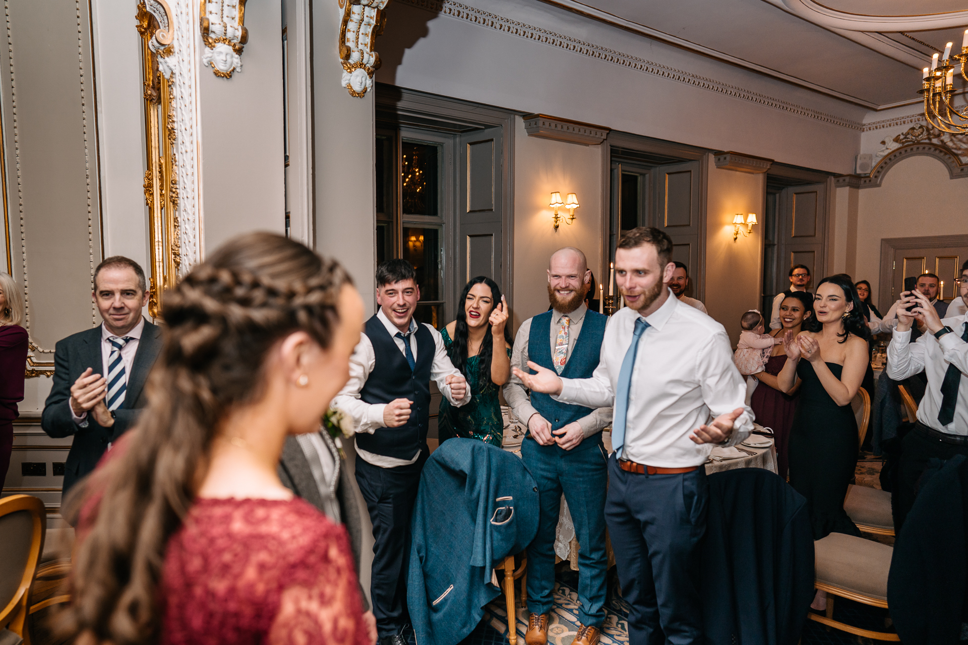 A group of people standing in a room