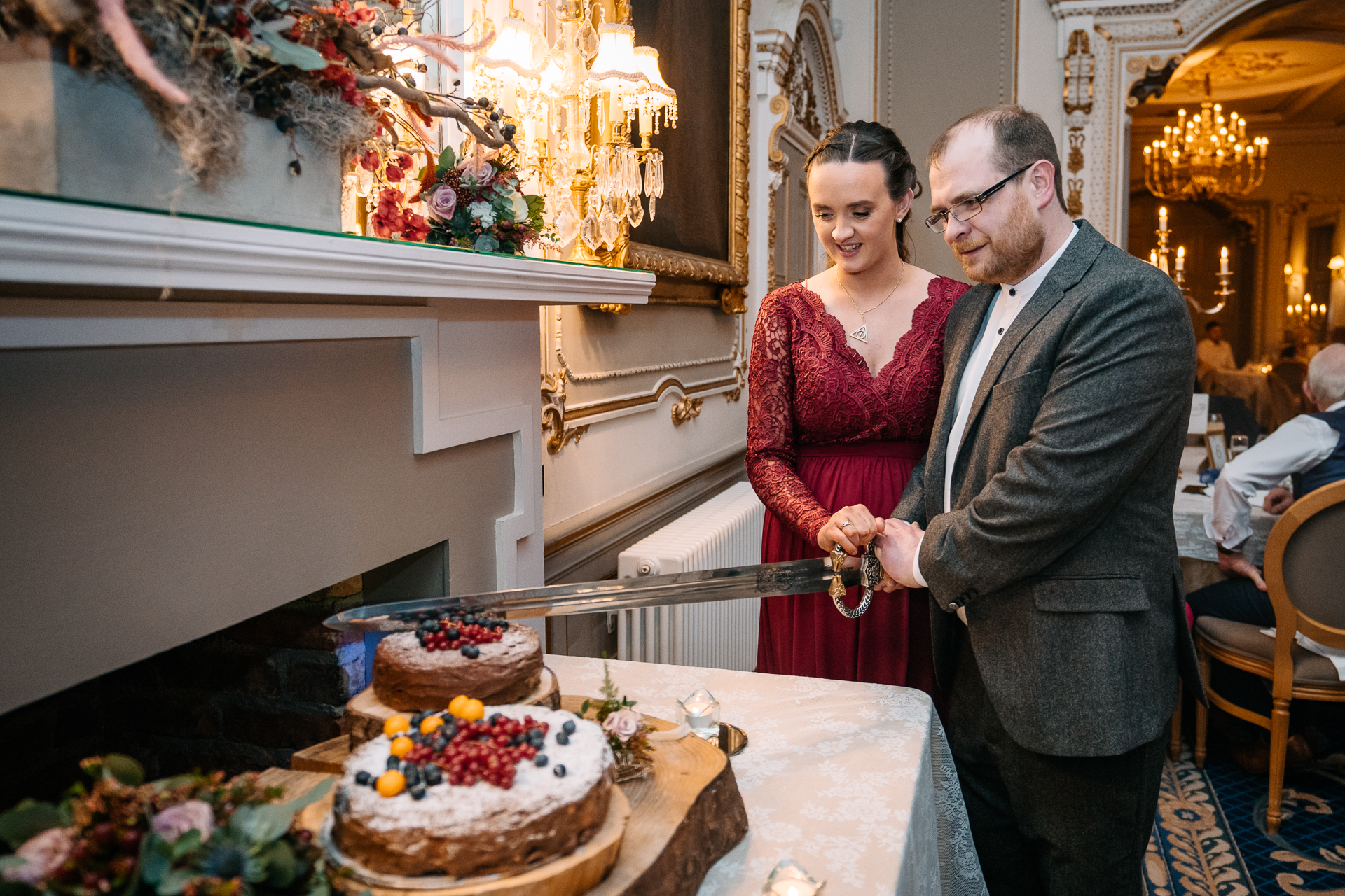 A couple cutting a cake