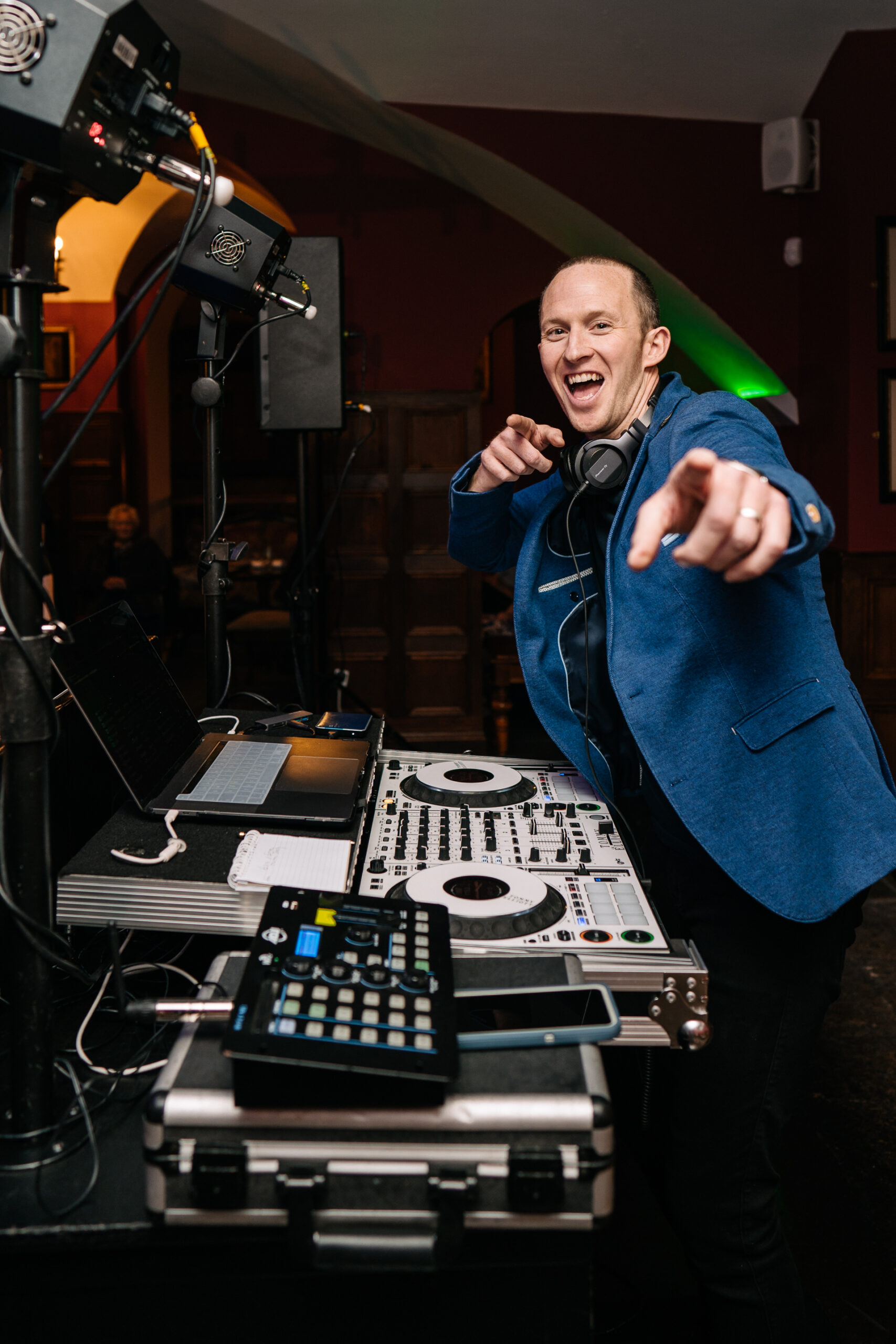 A person standing next to a dj booth