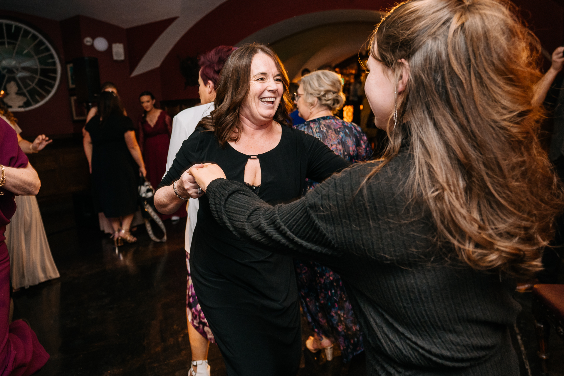 A woman dancing with another woman