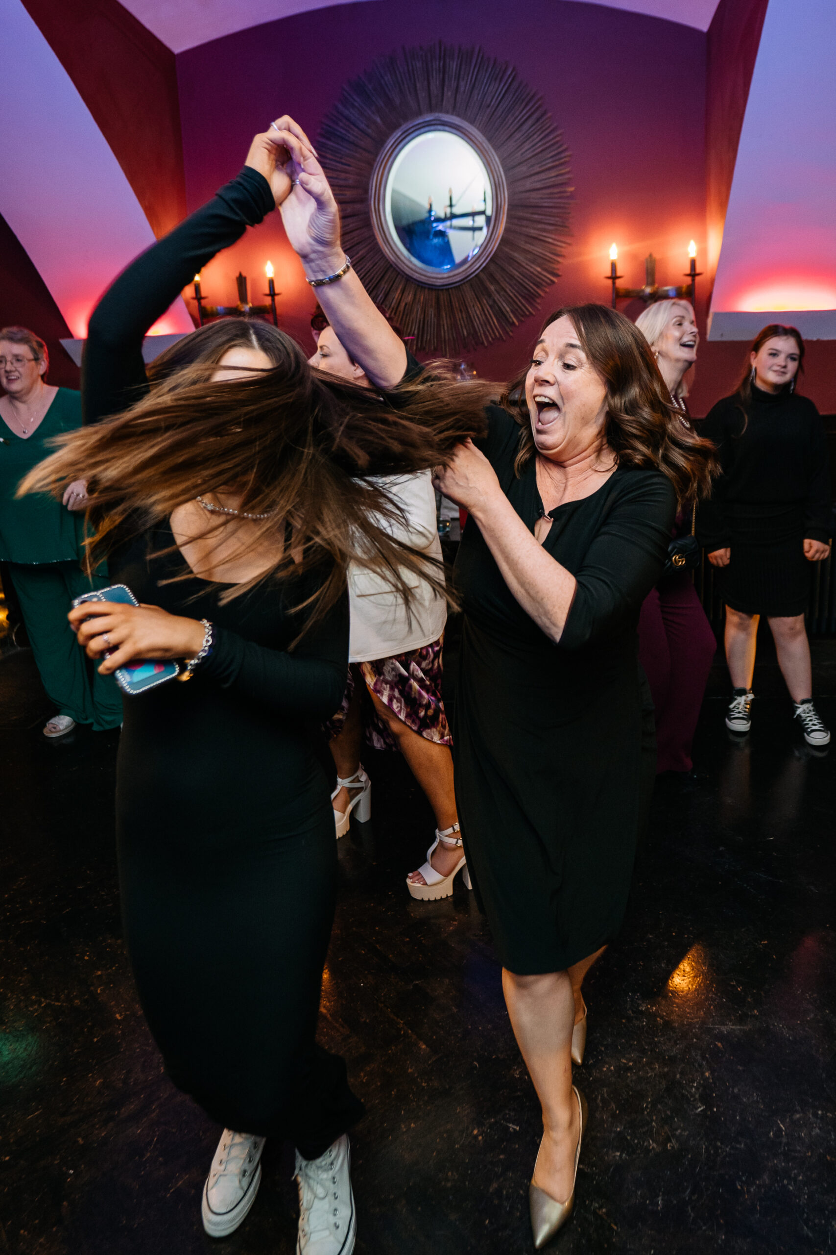 A couple of women dancing