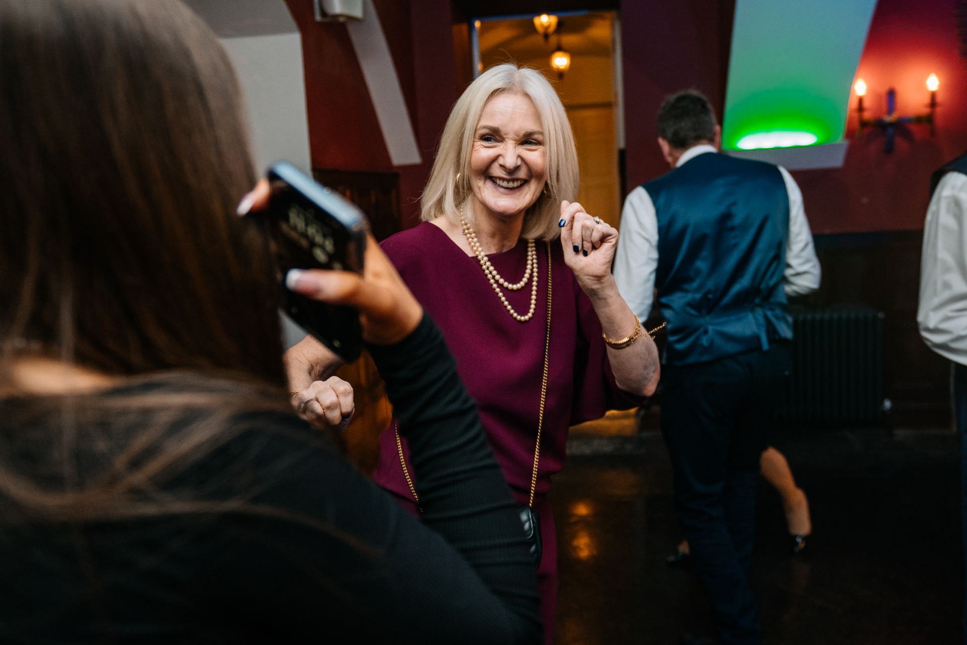 A woman holding a phone