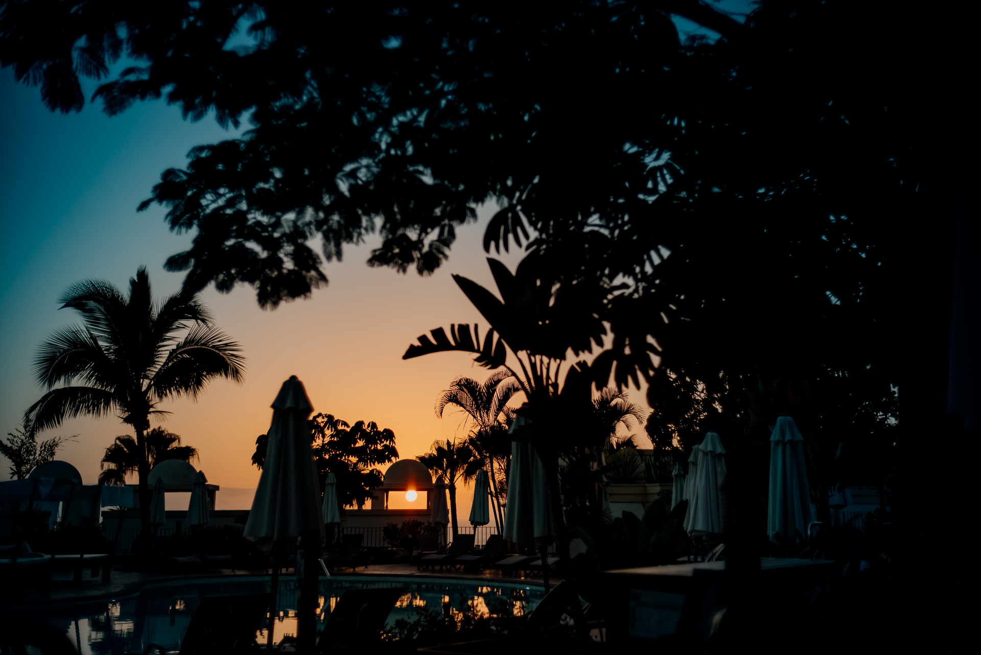 A sunset behind a beach