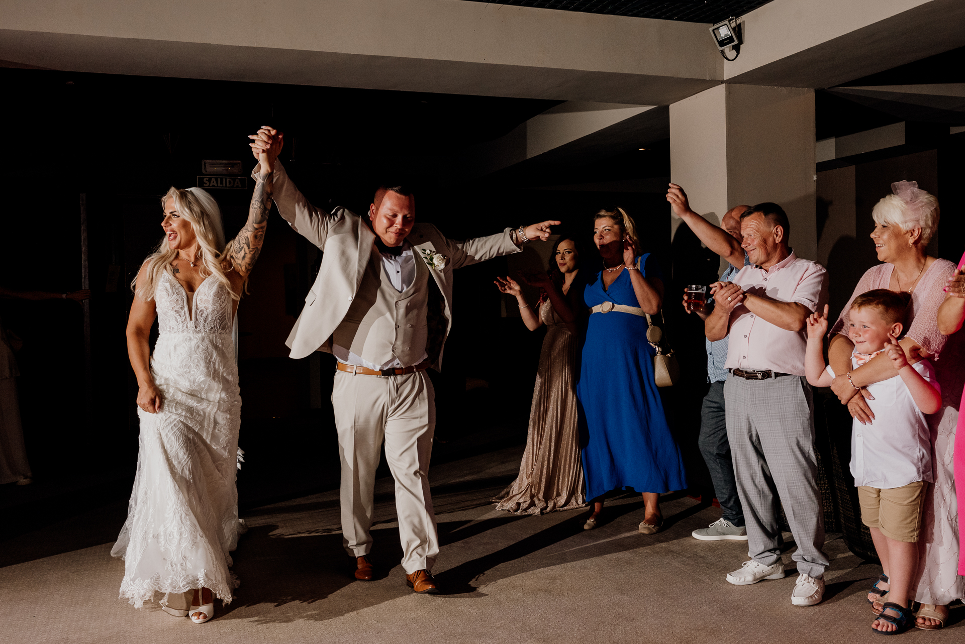 A man and woman dancing with a group of people