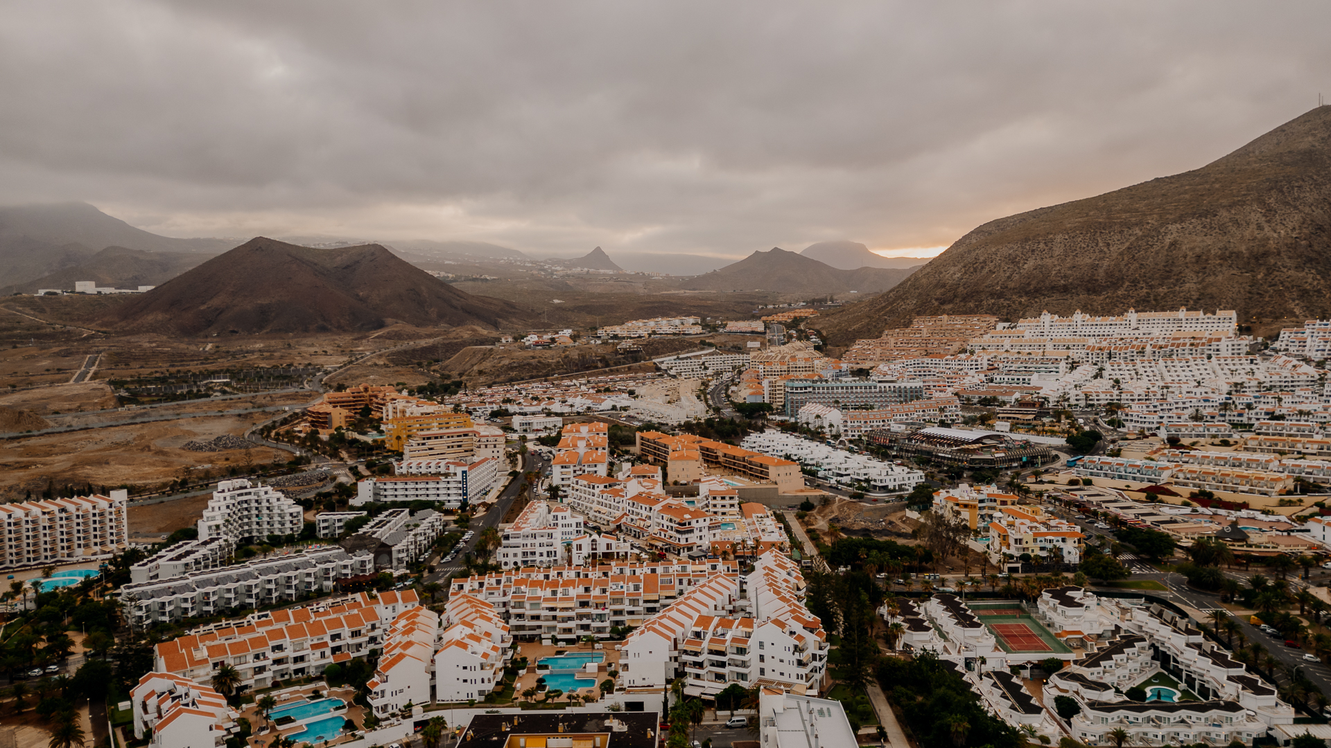 A city with mountains in the background