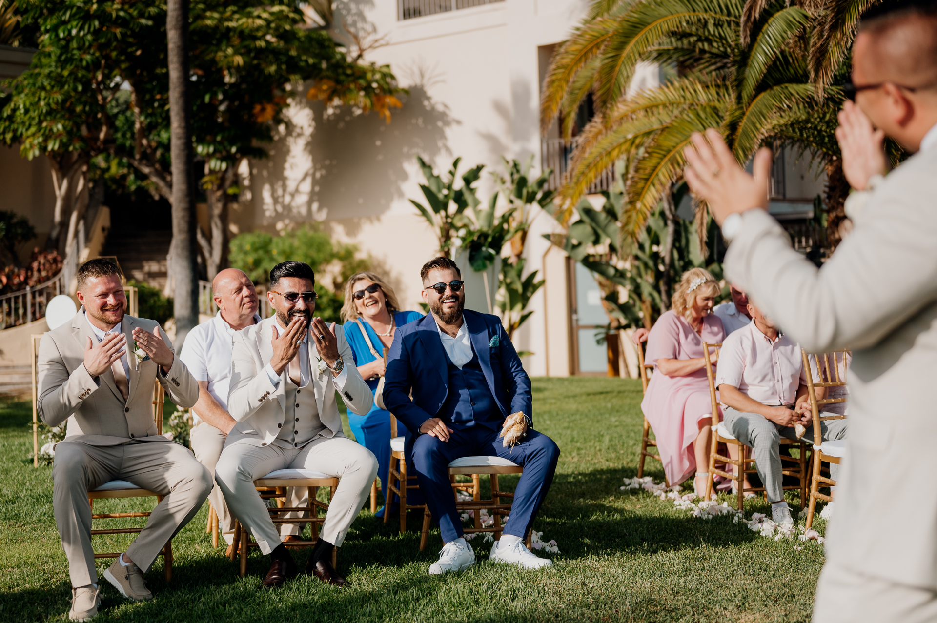 A person giving a speech to a group of people sitting in chairs