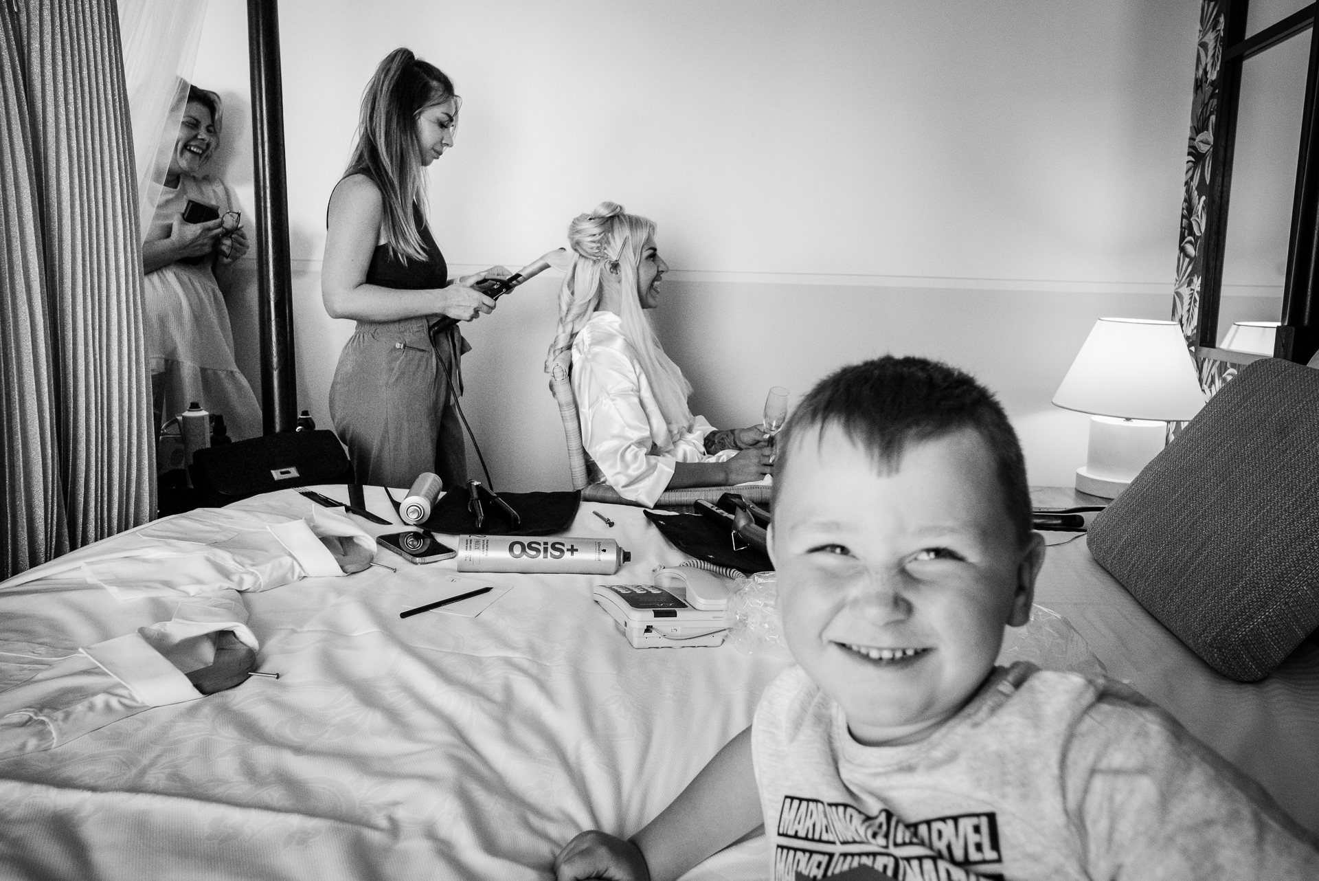 A boy sitting on a bed