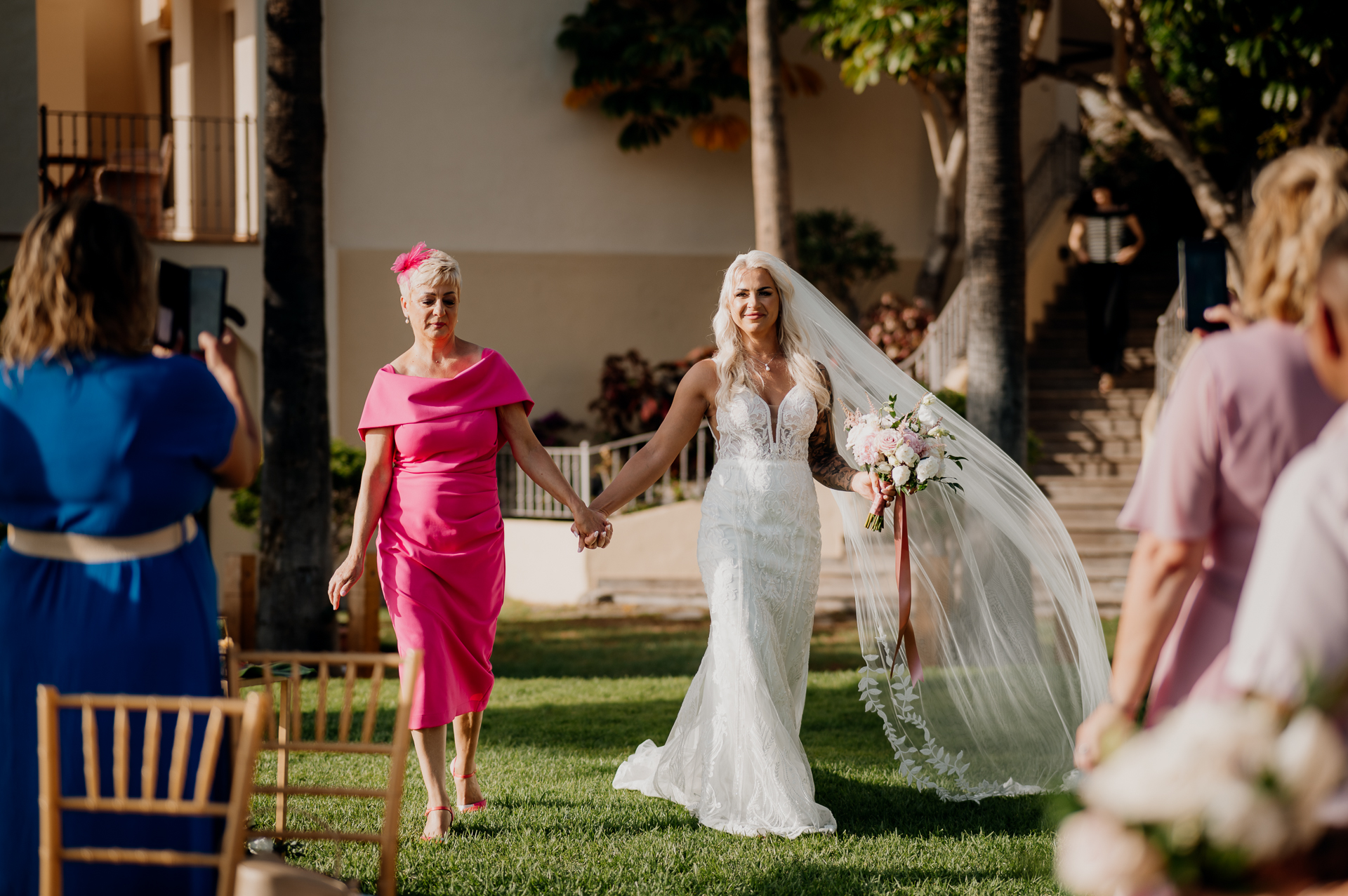 A person in a white dress and a person in a white dress