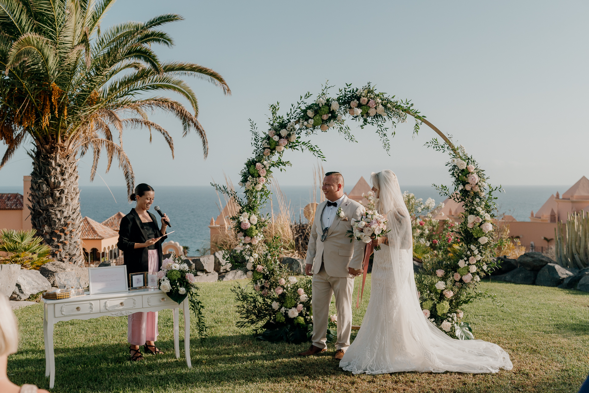 A bride and groom posing for a picture