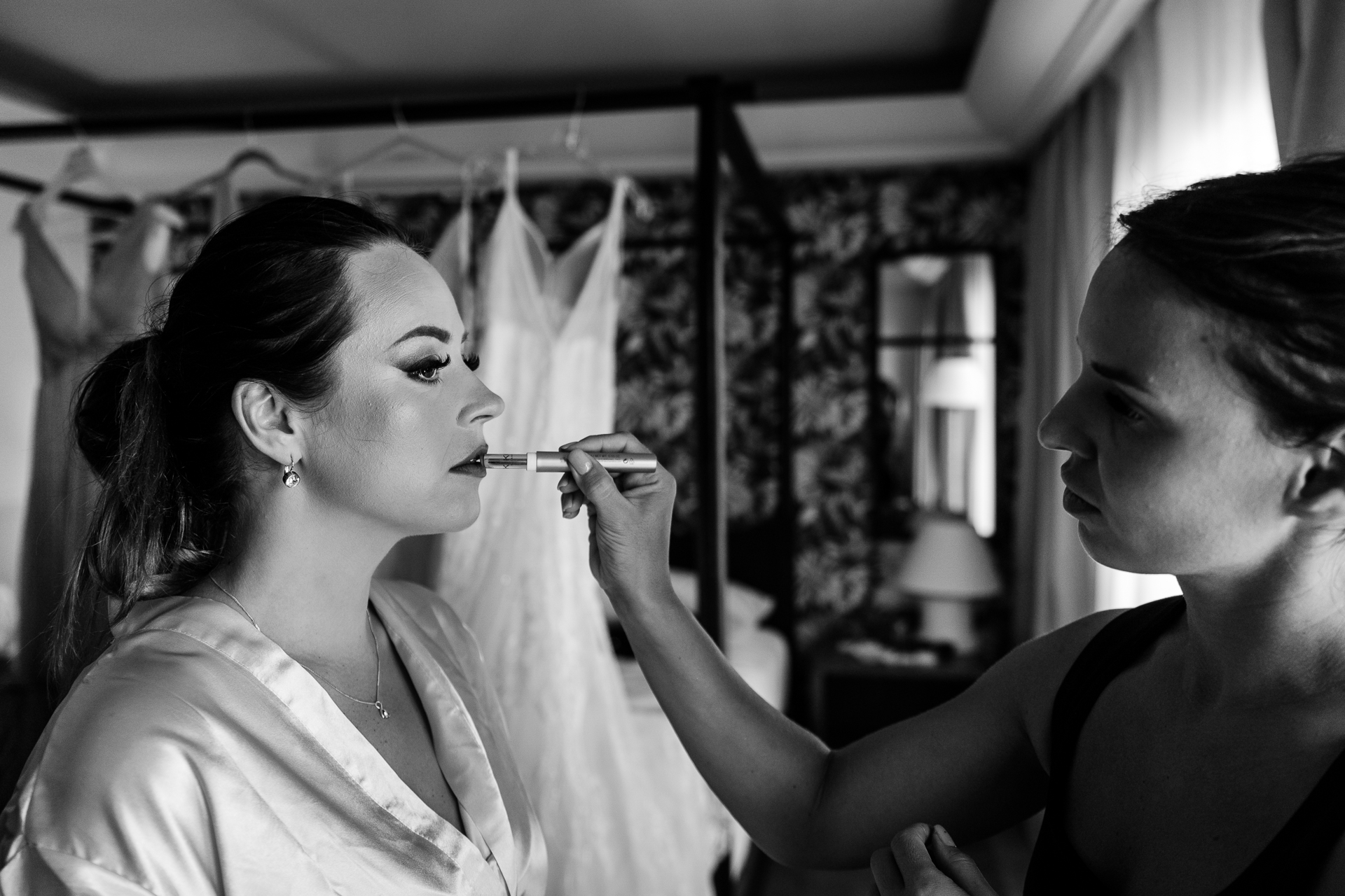 A woman brushing another woman's teeth